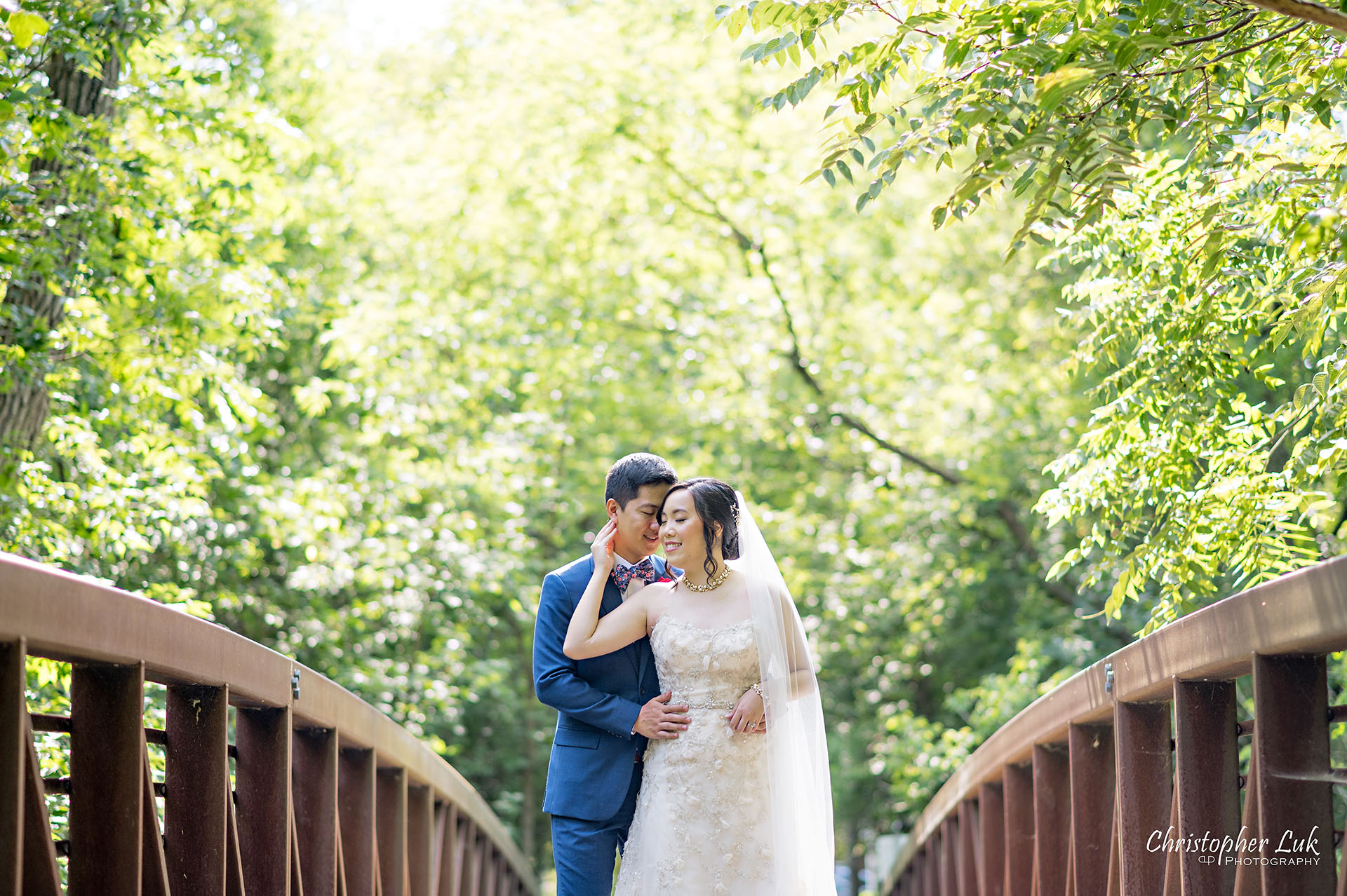 Christopher Luk Toronto Wedding Photographer Bridle Trail Baptist Church Unionville Main Street Crystal Fountain Event Venue Bride Groom Natural Photojournalistic Candid Creative Portrait Session Pictures Forest Trail Walkway Bridge Park Hug Kiss Portrait Intimate