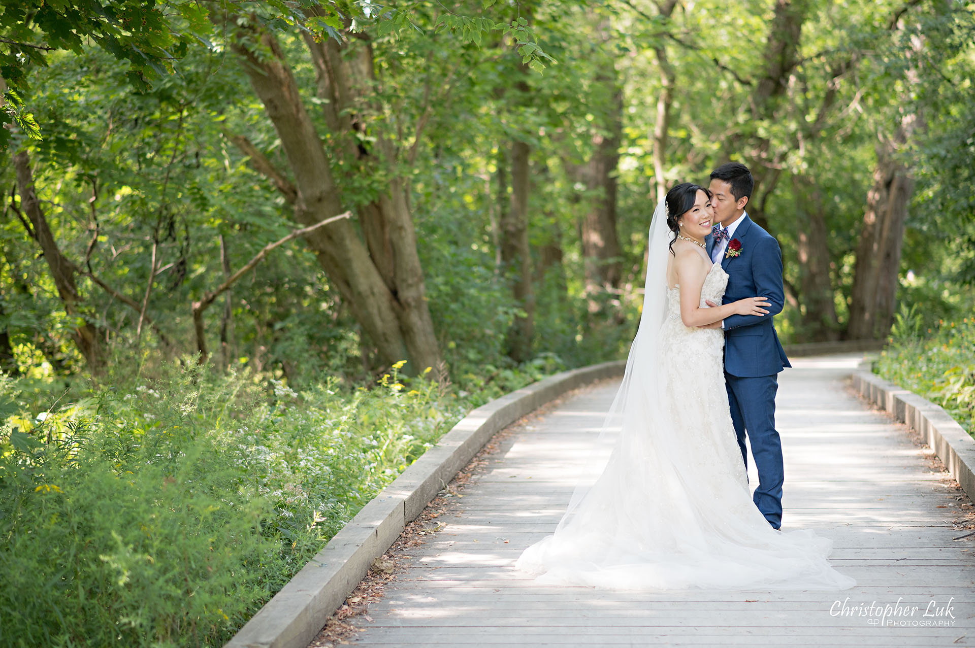 Christopher Luk Toronto Wedding Photographer Bridle Trail Baptist Church Unionville Main Street Crystal Fountain Event Venue Bride Groom Natural Photojournalistic Candid Creative Portrait Session Pictures Forest Trail Walkway Boardwalk Hug Kiss Landscape