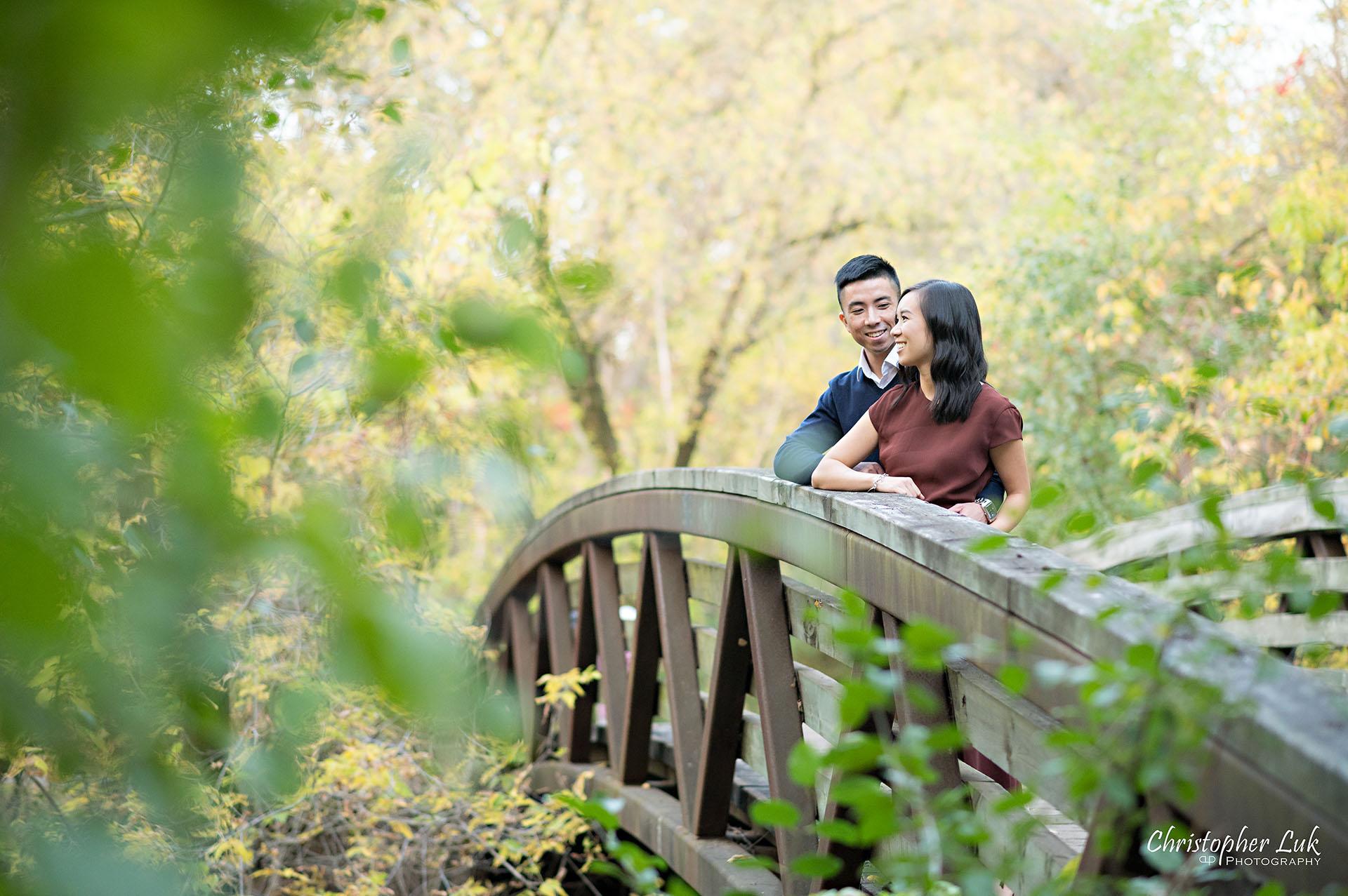 Christopher Luk Toronto Wedding Engagement Session Photographer Autumn Fall Leaves Natural Candid Photojournalistic Bride Groom Bridge Hug Hold Detail