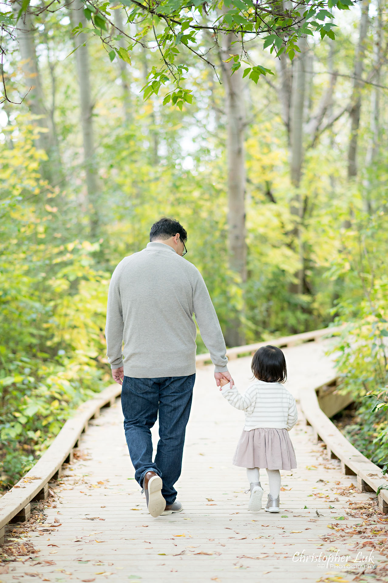 Christopher Luk Markham Family Photographer Autumn Leaves Fall Season Candid Photojournalistic Natural Bright Timeless Elegant Boardwalk Father Daughter Holding Hands Walking Together