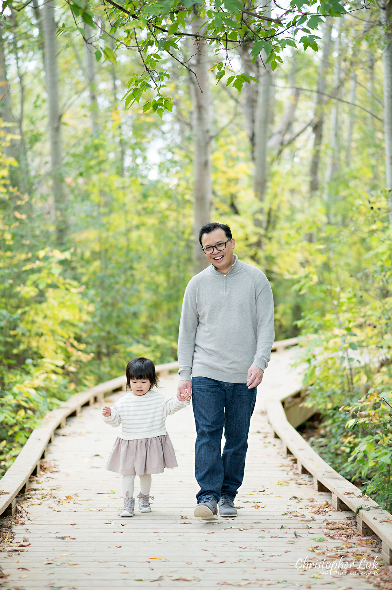 Christopher Luk Markham Family Photographer Autumn Leaves Fall Season Candid Photojournalistic Natural Bright Timeless Elegant Boardwalk Father Daughter Holding Hands Walking Together