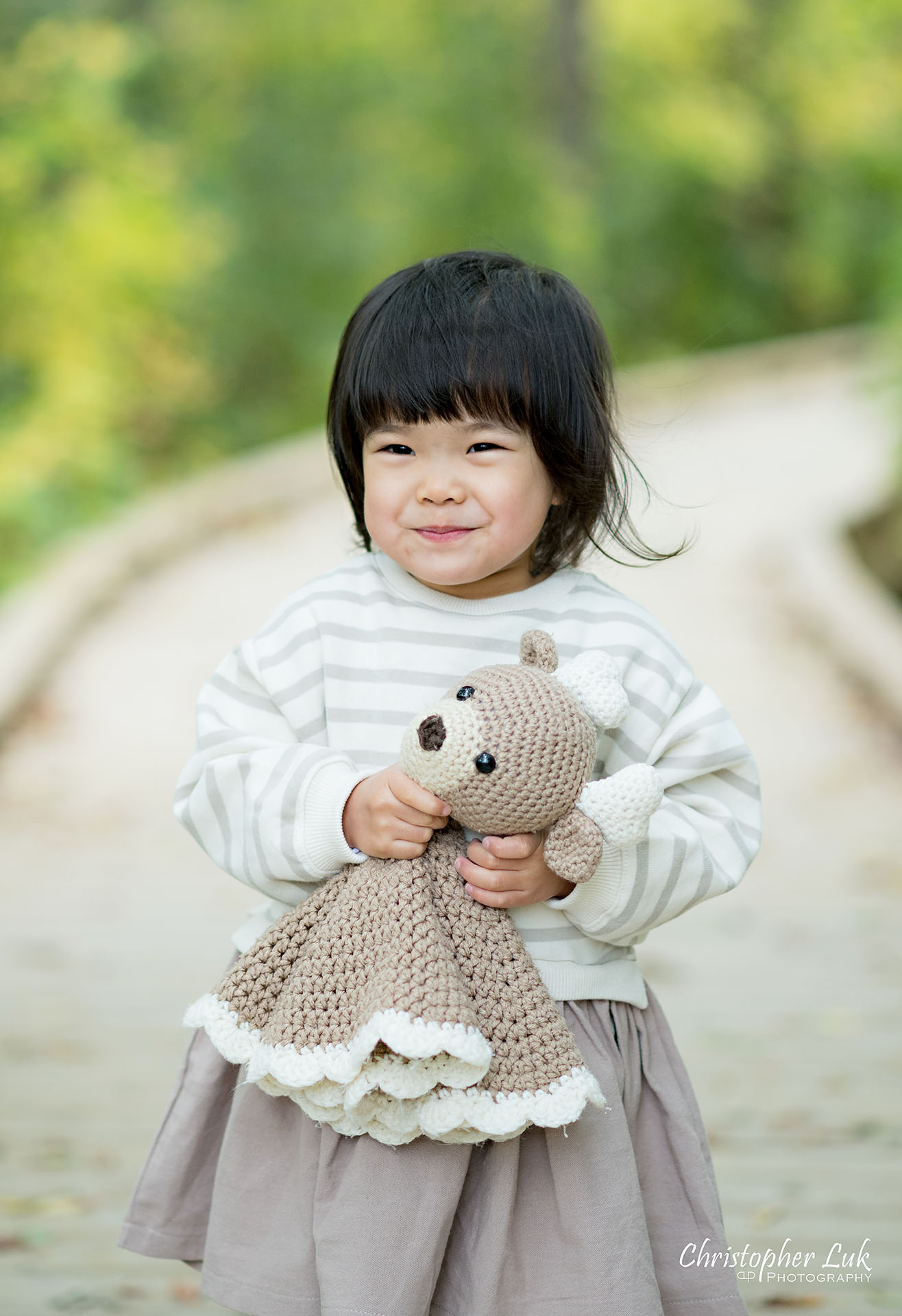 Christopher Luk Markham Family Photographer Autumn Leaves Fall Season Candid Photojournalistic Natural Bright Timeless Daughter Sister Stuffed Animal Smile Detail