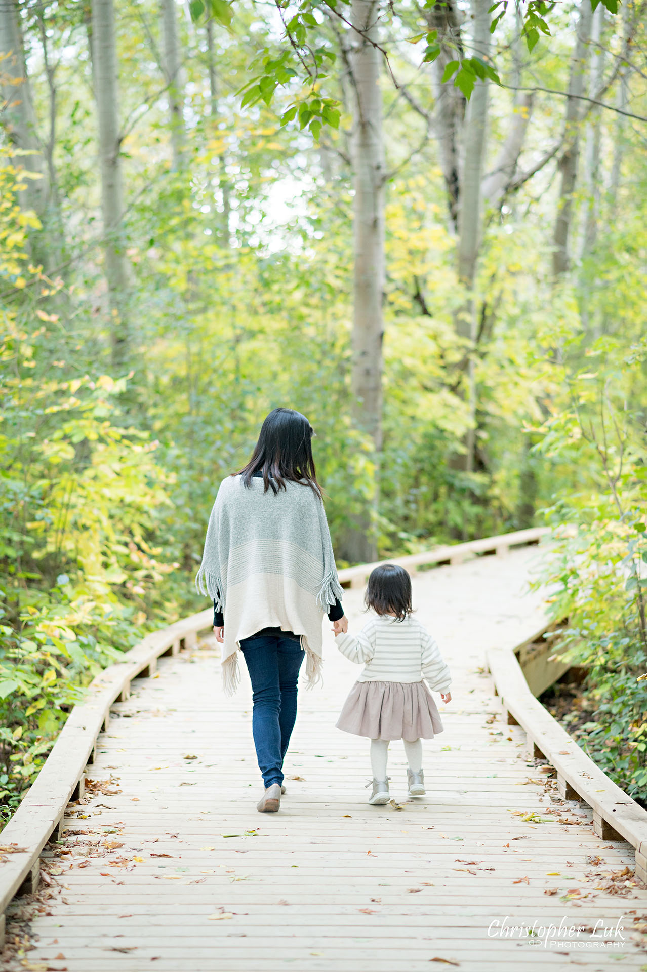 Christopher Luk Markham Family Photographer Autumn Leaves Fall Season Candid Photojournalistic Natural Bright Timeless Elegant Boardwalk Mother Daughter Holding Hands Walking Together