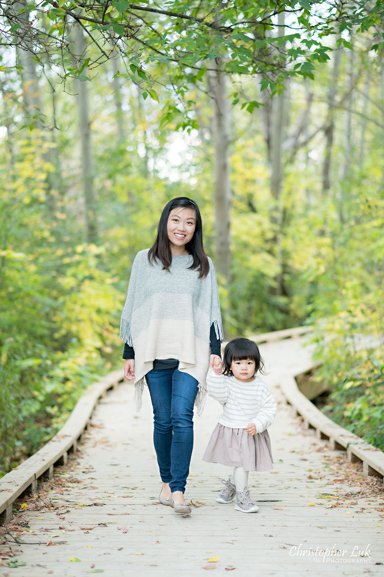 Christopher Luk Markham Family Photographer Autumn Leaves Fall Season Candid Photojournalistic Natural Bright Timeless Elegant Boardwalk Mother Daughter Holding Hands Walking Together