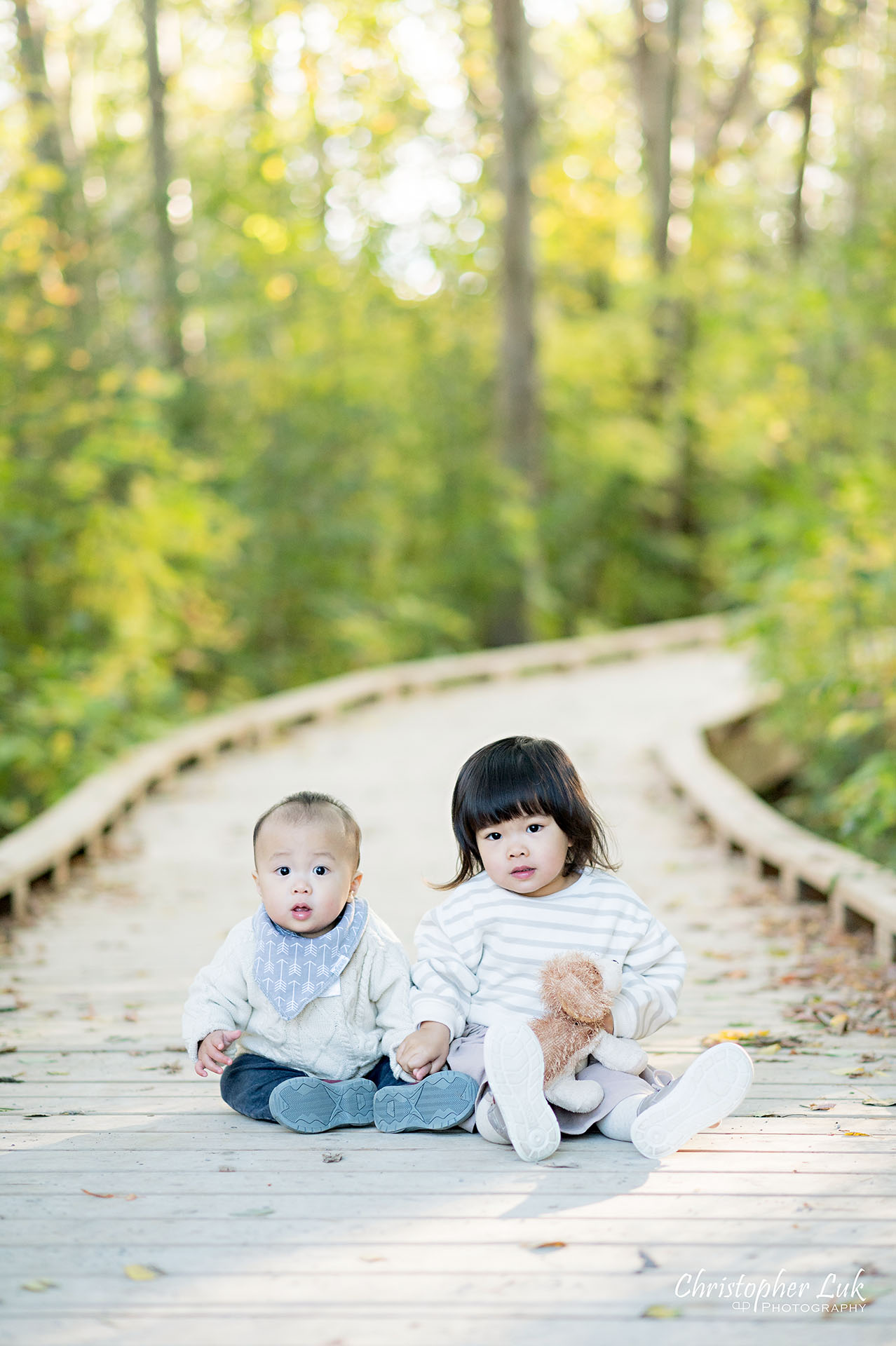 Christopher Luk Markham Family Photographer Autumn Leaves Fall Season Candid Photojournalistic Natural Bright Timeless Brother Sister Daughter Son Holding Hands Portrait