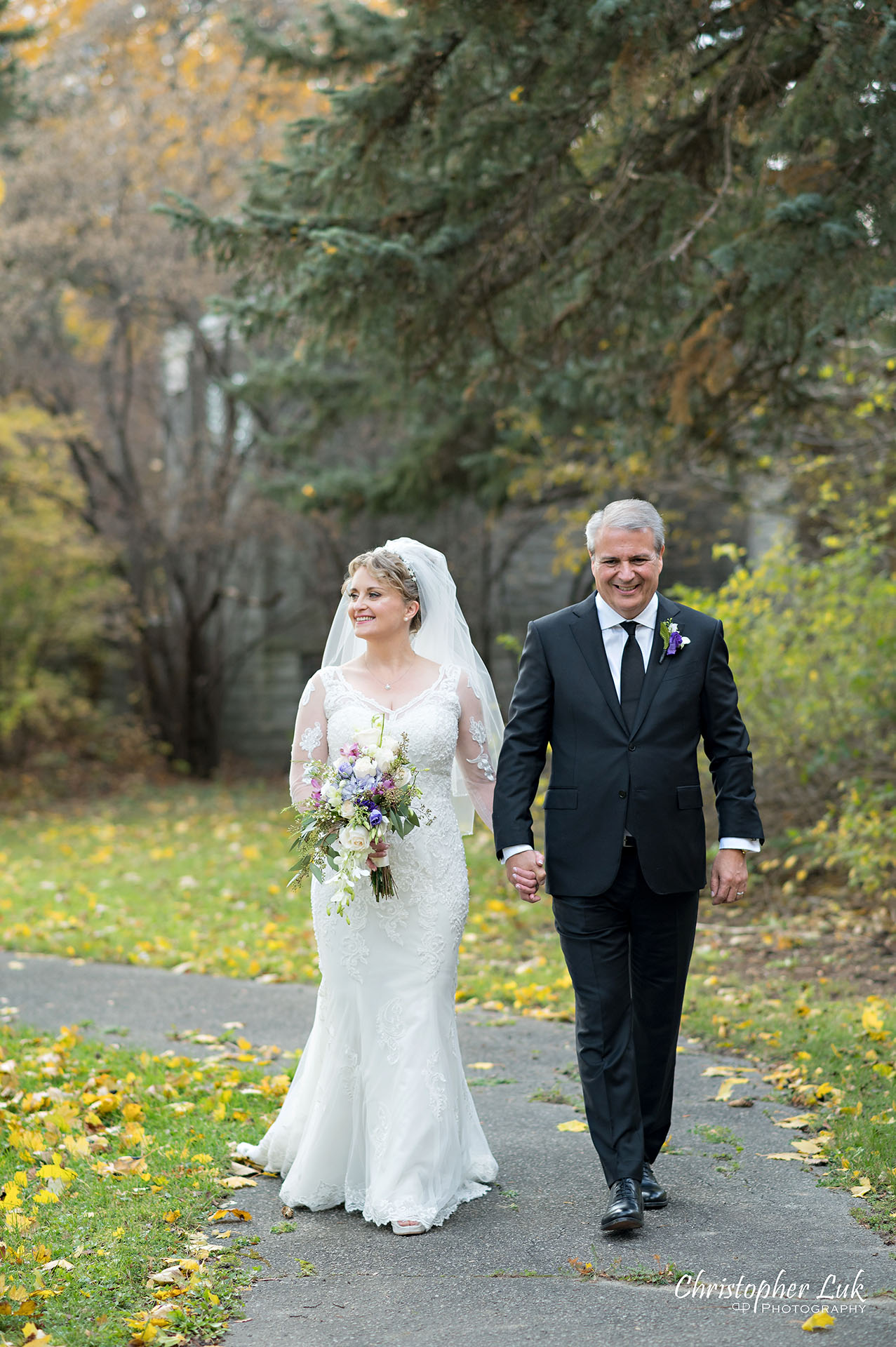 Christopher Luk Toronto Wedding Photographer Natural Candid Photojournalistic Tyndale Chapel Autumn Fall Leaves Bride Groom Holding Hands Walking Together Portrait