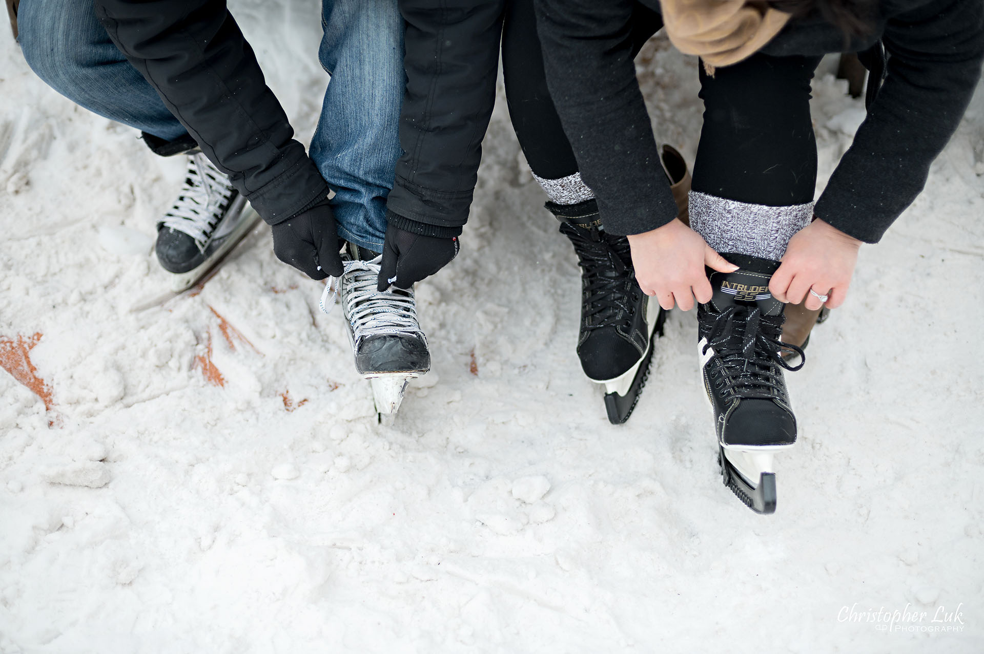 Christopher Luk Toronto Wedding Photographer Ice Skating Trail Winter Engagement Session Natural Photojournalistic Candid Bride Groom Tying Skates
