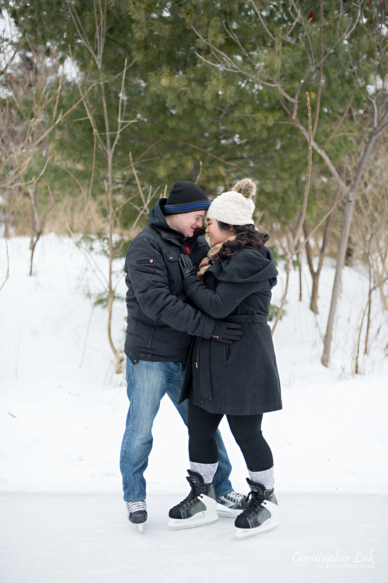 Christopher Luk Toronto Wedding Photographer Ice Skating Trail Winter Engagement Session Natural Photojournalistic Candid Bride Groom Portrait Forehead Hug