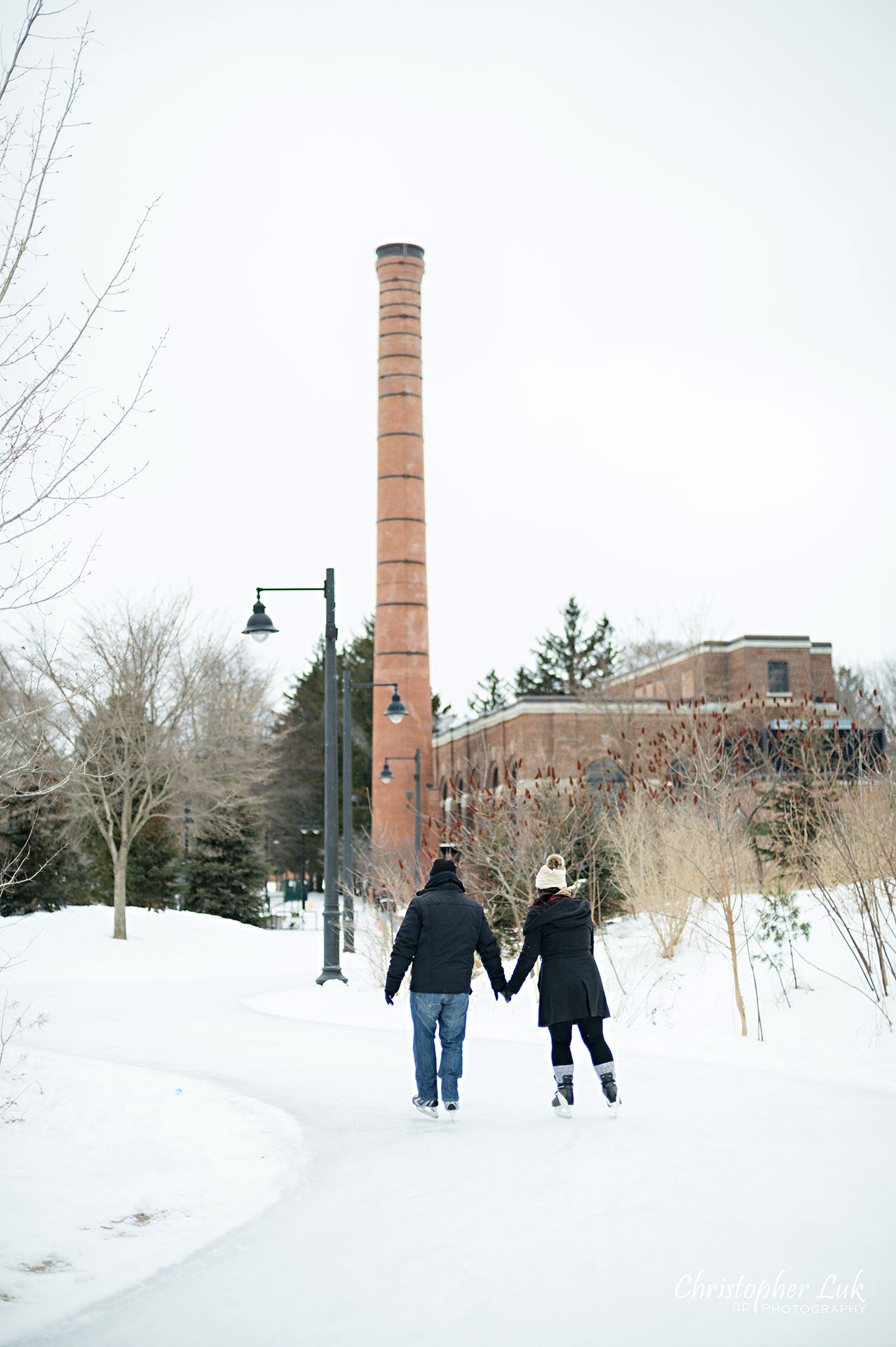 Christopher Luk Toronto Wedding Photographer Ice Skating Trail Winter Engagement Session Natural Photojournalistic Candid Bride Groom Portrait Colonel Samuel Smith Park Red Brick Factory Building 