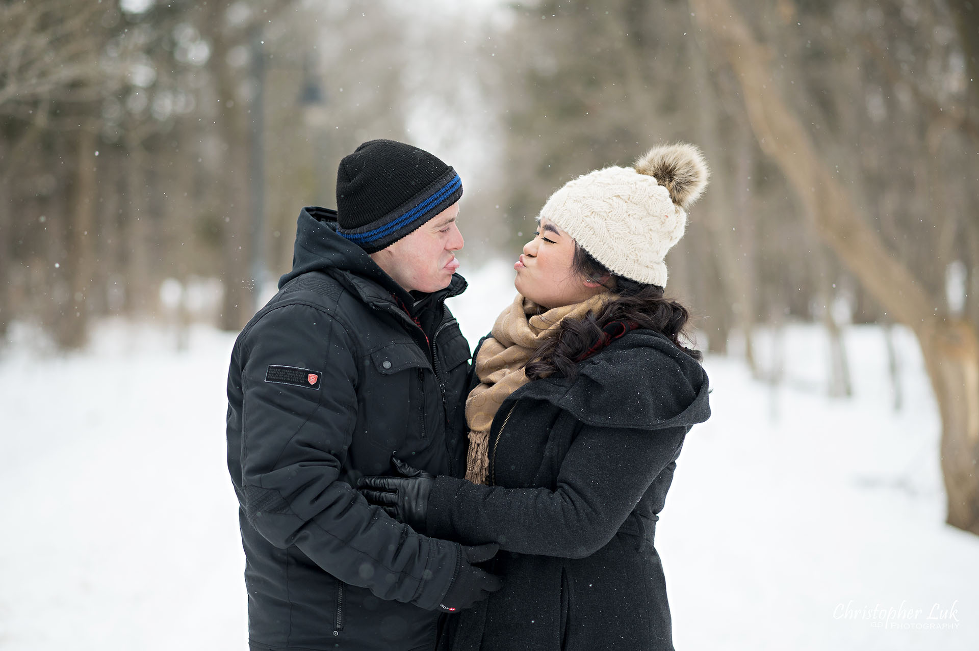 Christopher Luk Toronto Wedding Photographer Ice Skating Trail Winter Engagement Session Natural Photojournalistic Candid Bride Groom Portrait Colonel Samuel Smith Park Double Tree Lined Walking Path Pathway Walkway Landscape Funny Faces 