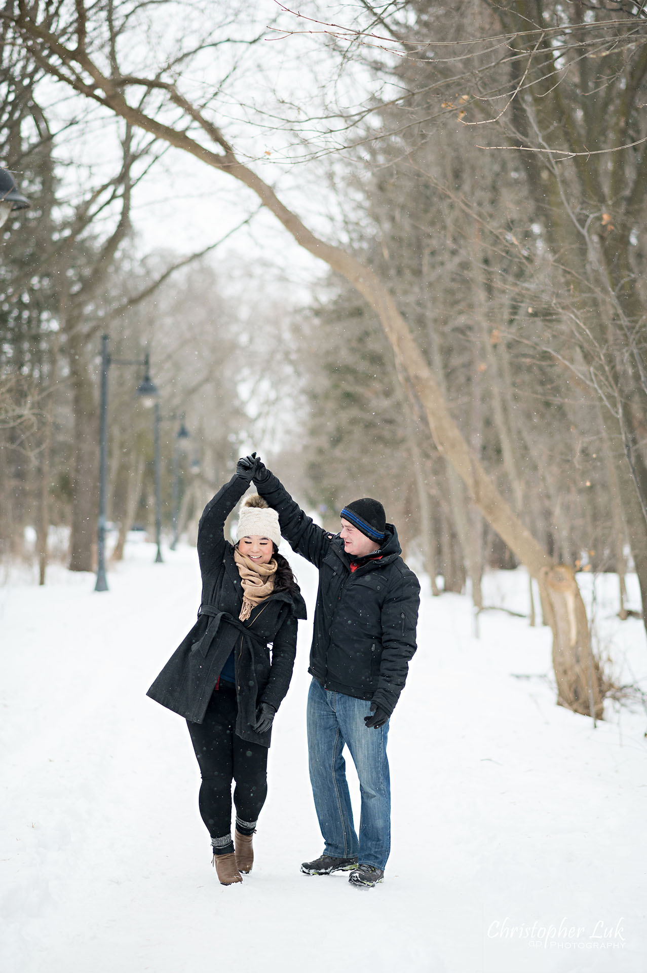 Christopher Luk Toronto Wedding Photographer Ice Skating Trail Winter Engagement Session Natural Photojournalistic Candid Bride Groom Portrait Colonel Samuel Smith Park Double Tree Lined Walking Path Pathway Walkway Landscape Dancing Spinning Twirling Twirl 
