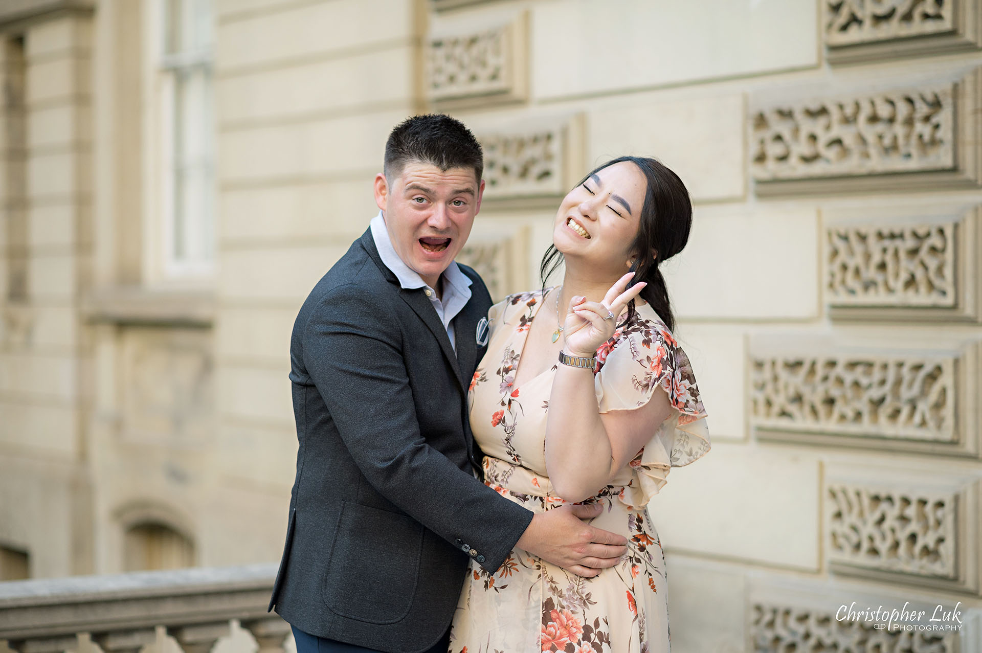 Christopher Luk Toronto Wedding Photographer Engagement Photos Pictures Session Osgoode Hall Nathan Philips Square City Hall Bride Groom Natural Candid Photojournalistic Organic Sunset Funny Silly Faces Cheese Peace Fingers Landscape