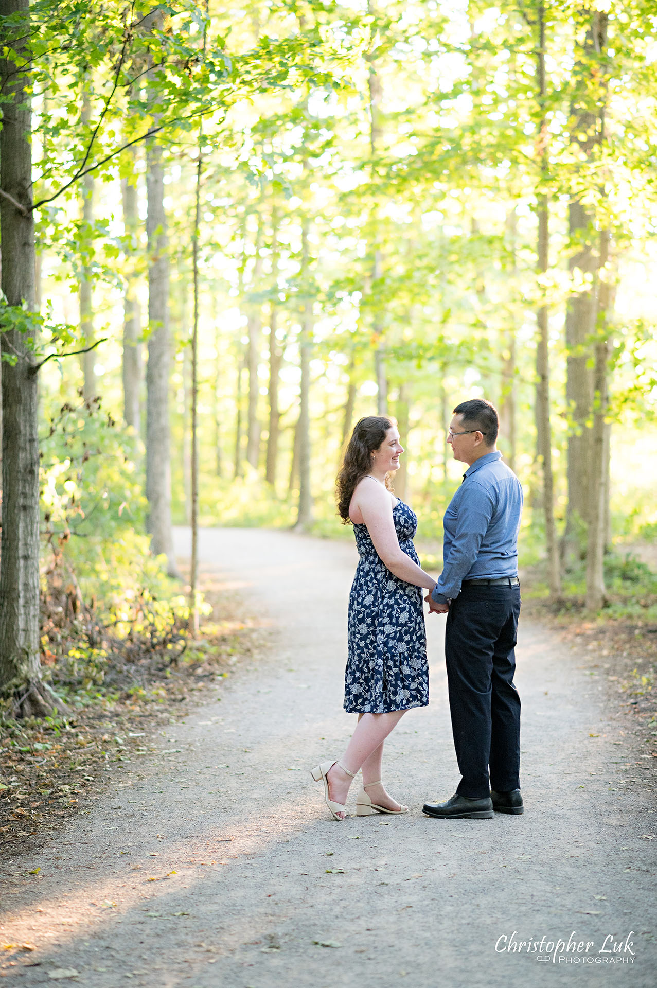 Christopher Luk Toronto Wedding Photographer Markham Forest Engagement Photos Pictures Session Bride Groom Holding Hands Looking At Each Other Candid Natural Organic Photojournalistic Portrait