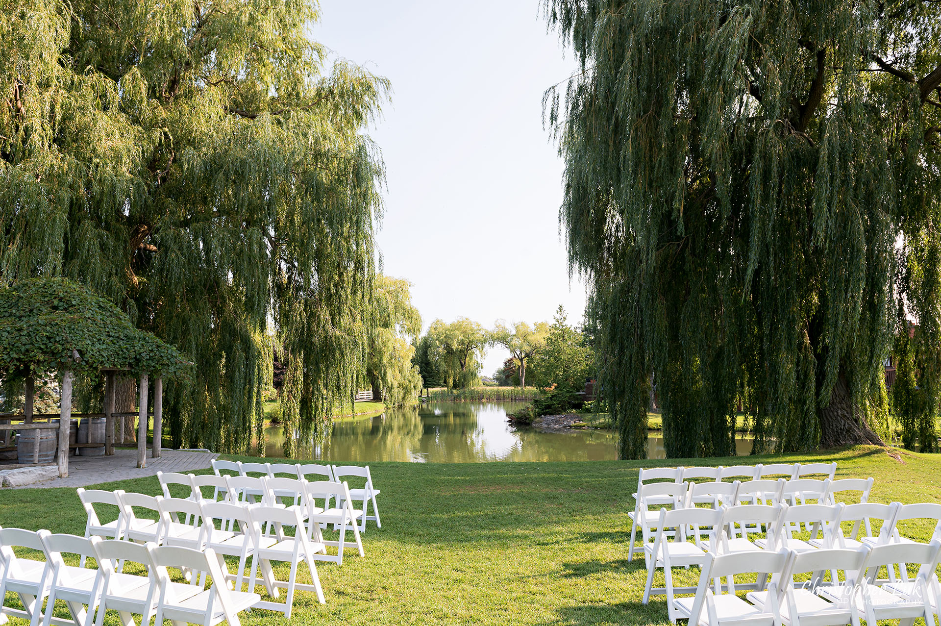 Willow Springs Winery Outdoor Ceremony Location Venue Mature Trees Overlooking Pond 