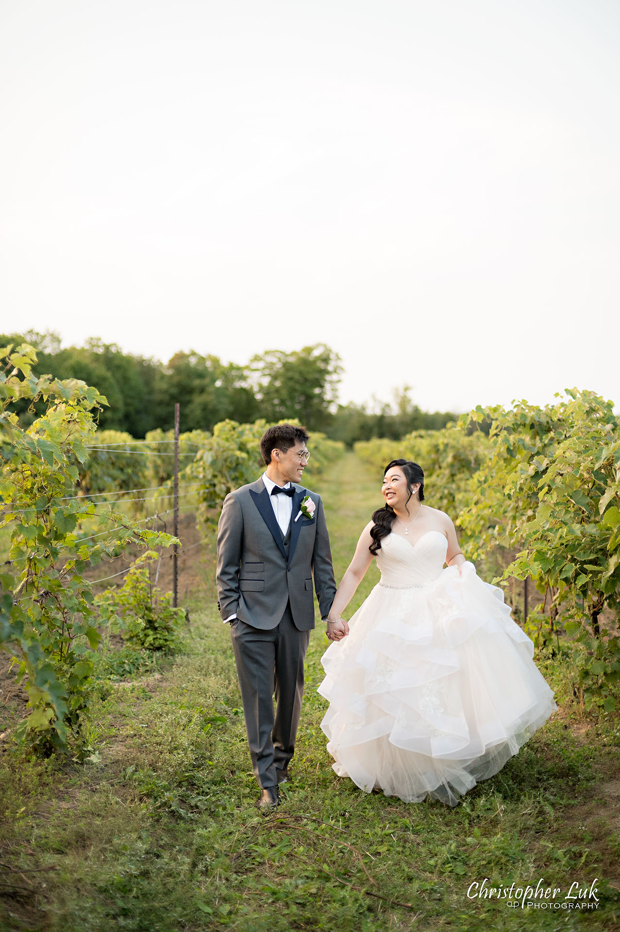 Willow Springs Winery Bride Groom Portrait Candid Natural Photojournalistic Vineyard Rows of Grape Vines Holding Hands Walking Together
