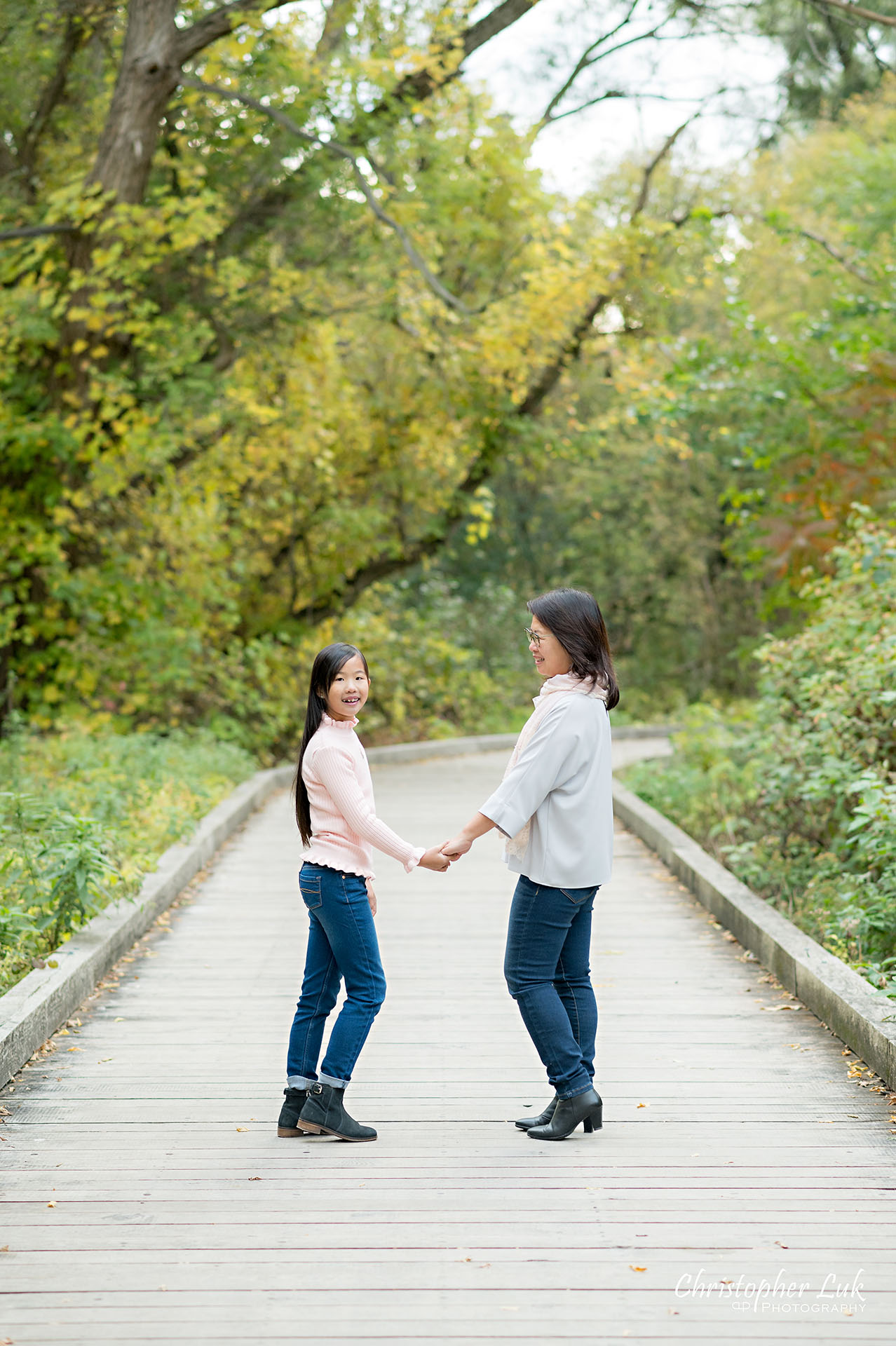 Mother Holding Hands Walking Together with Daughter Smile Portrait Main Street Unionville Markham Boardwalk Forest Toronto Family Photographer