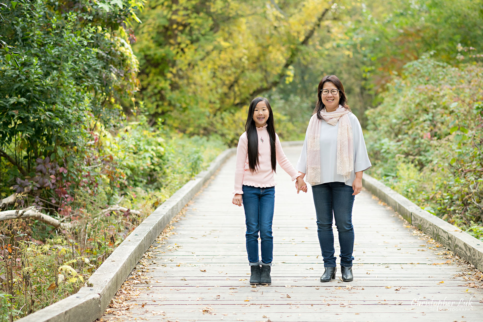 Mother Holding Hands Walking Together with Daughter Happy Landscape Main Street Unionville Markham Boardwalk Forest Toronto Family Photographer