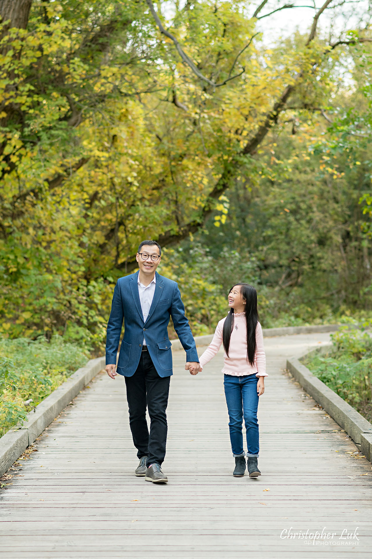 Father Holding Hands Walking Together with Daughter Fun Main Street Unionville Markham Boardwalk Forest Toronto Family Photographer