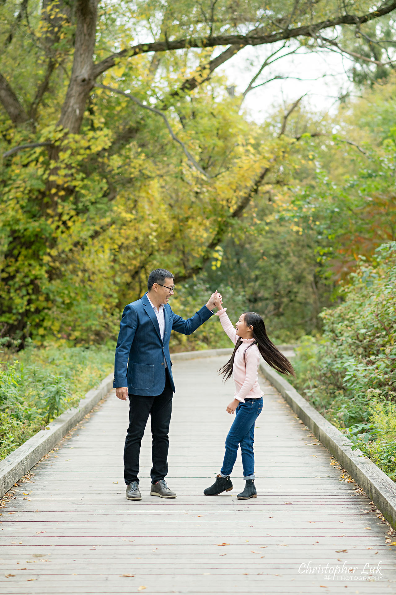 Father Twirling Spinning Dancing with Daughter Fun Main Street Unionville Markham Boardwalk Forest Toronto Family Photographer