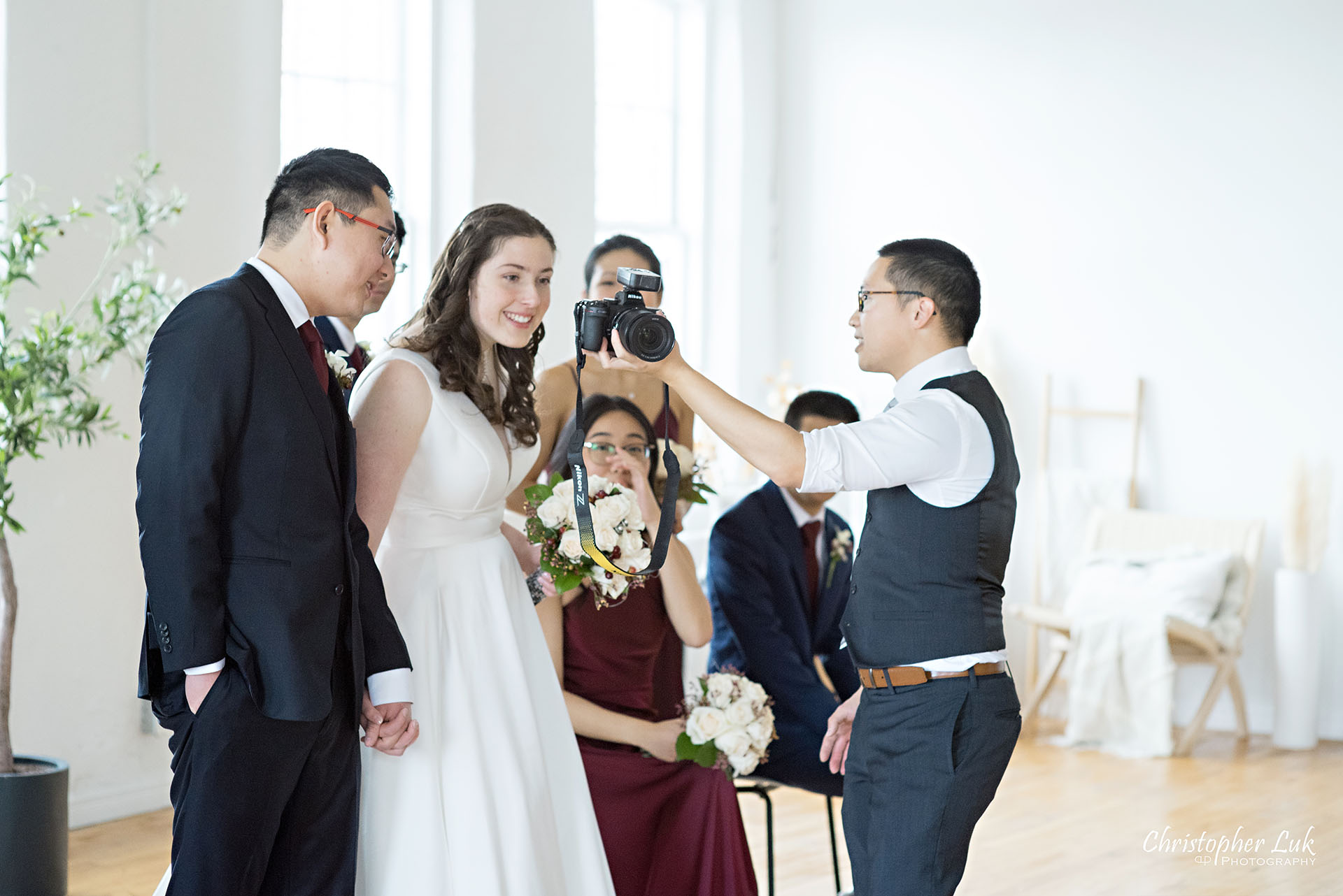 Toronto Wedding Photographer Behind the Scenes Bride Groom Reaction Smile Happy Seeing Pictures Images on Camera