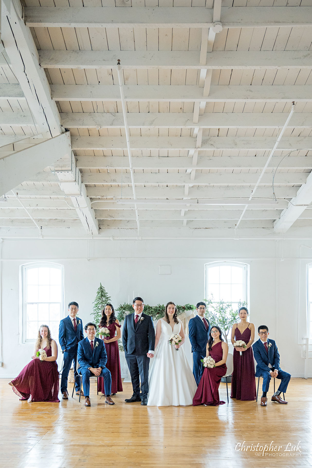 Wedding Party Bridal Bride Groom Bridesmaids Groomsmen Stylized Group Photo Vintage White Loft Studio Kitchener Waterloo Winter Christmas Portrait Smile