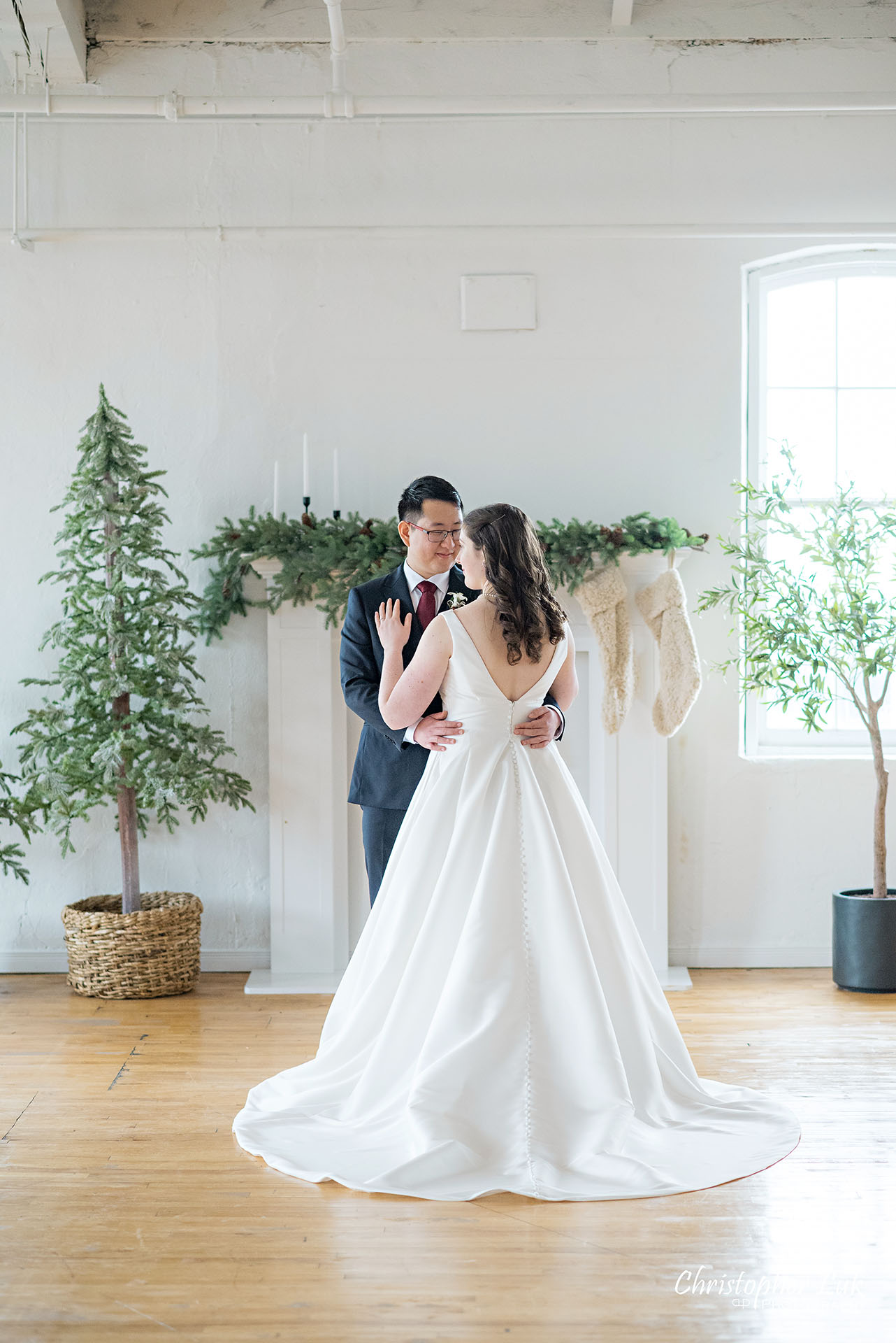 Bride Groom Vintage White Loft Studio Kitchener Waterloo Winter Christmas Natural Candid Photojournalistic Happy Smile Hug Hold Each Other Portrait Bridal Gown Dress Train 