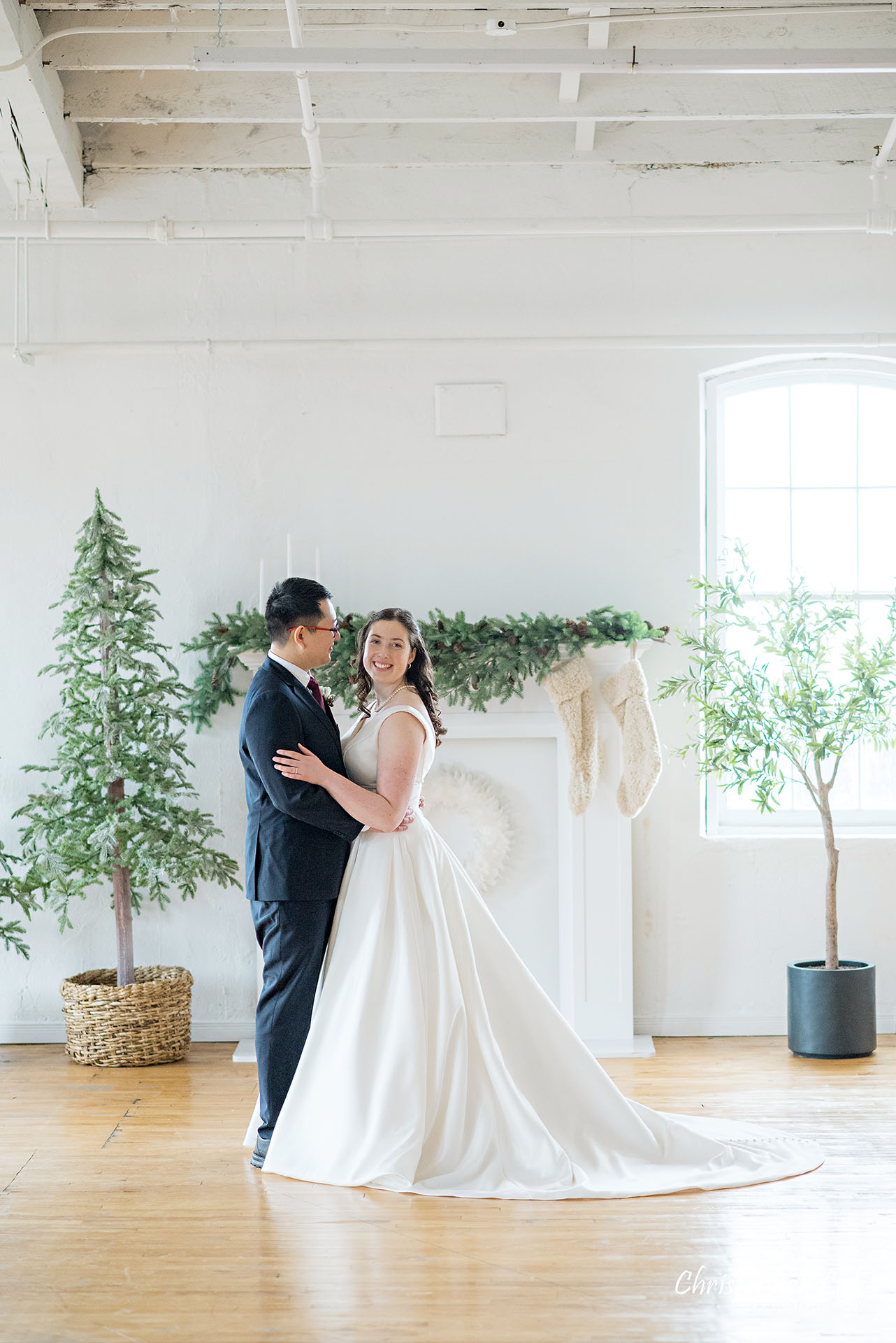 Bride Groom Vintage White Loft Studio Kitchener Waterloo Winter Christmas Natural Candid Photojournalistic Happy Smile Hug Hold Each Other Portrait Bridal Gown Dress Train 