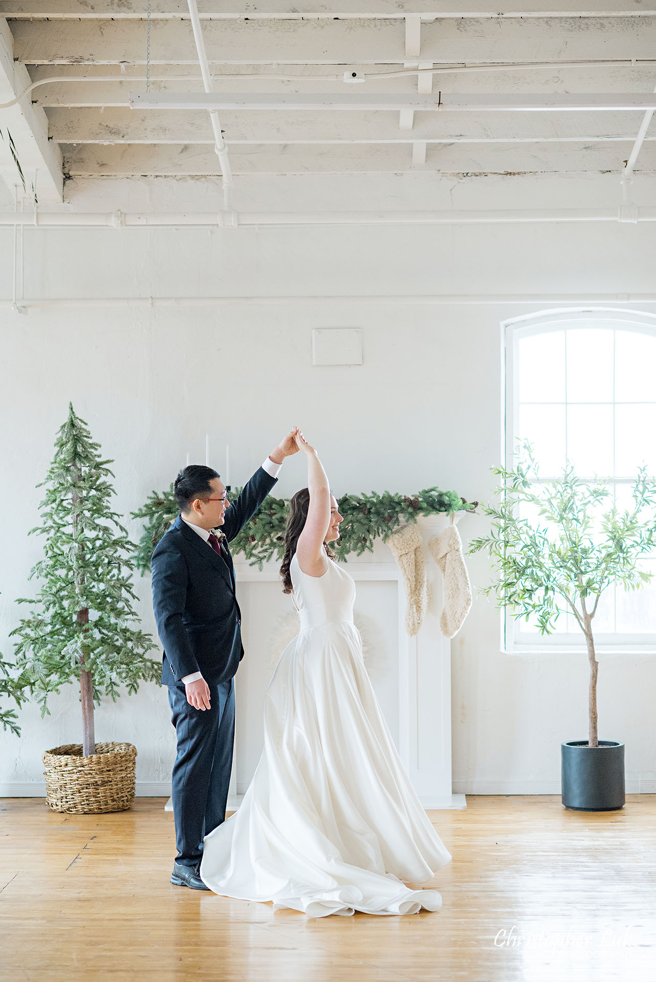 Bride Groom Vintage White Loft Studio Kitchener Waterloo Winter Christmas Natural Candid Photojournalistic Happy Smile Hug Hold Each Other Portrait Bridal Gown Dress Train Dancing Twirl Spin