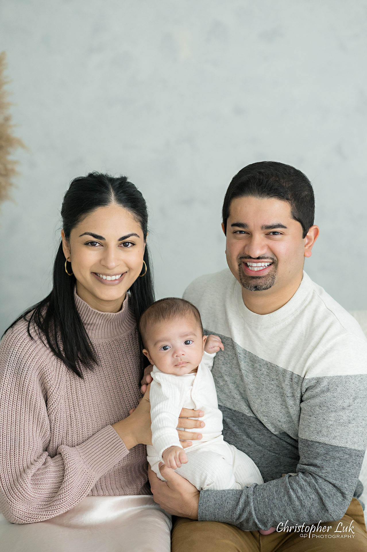 Mom Mommy Motherhood Mother Dad Daddy Fatherhood Father Holding Baby Boy Candid Natural Photojournalistic Portrait Smile