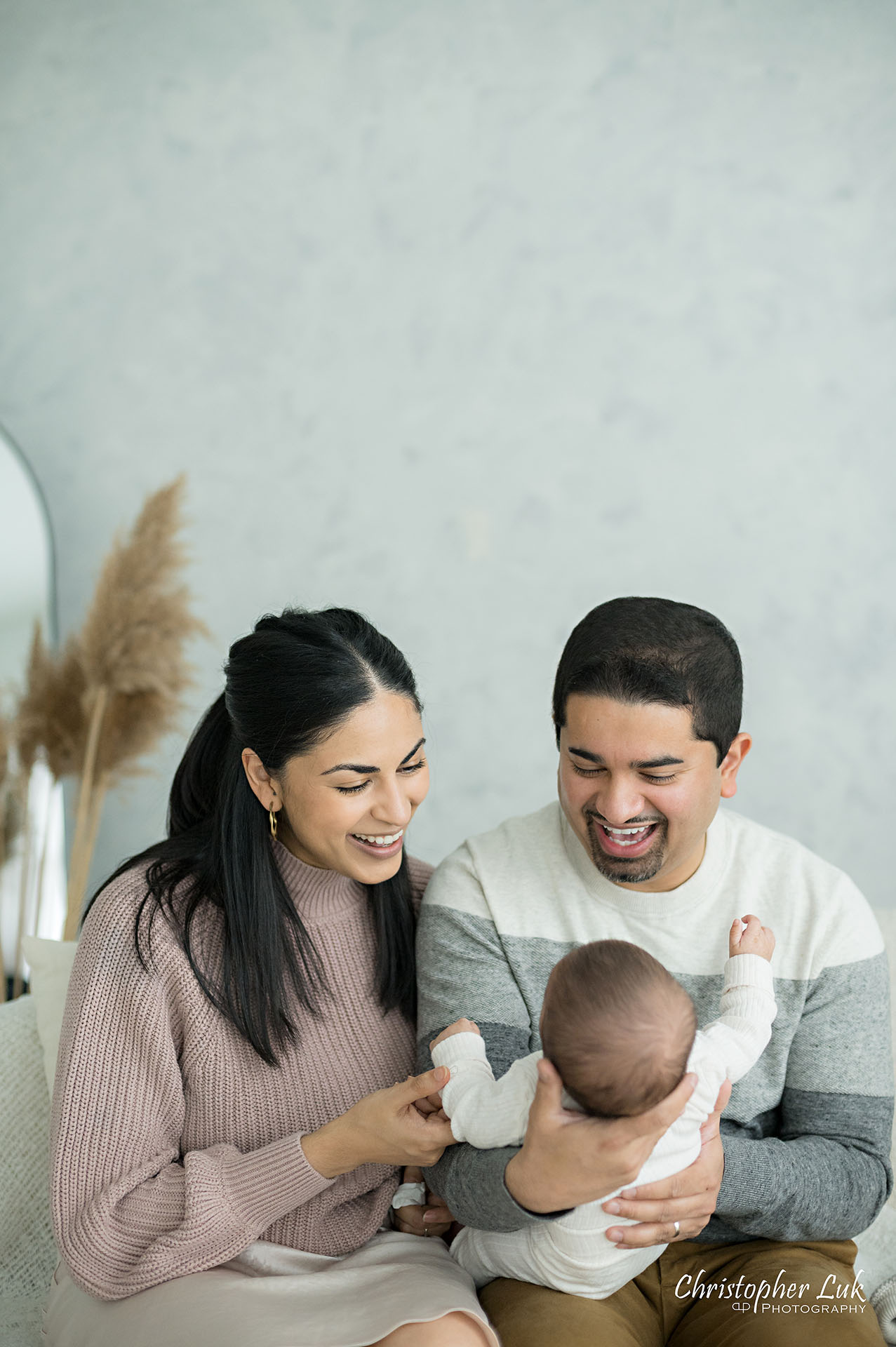 Mom Mommy Motherhood Mother Dad Daddy Fatherhood Father Holding Baby Candid Natural Photojournalistic Smile Portrait