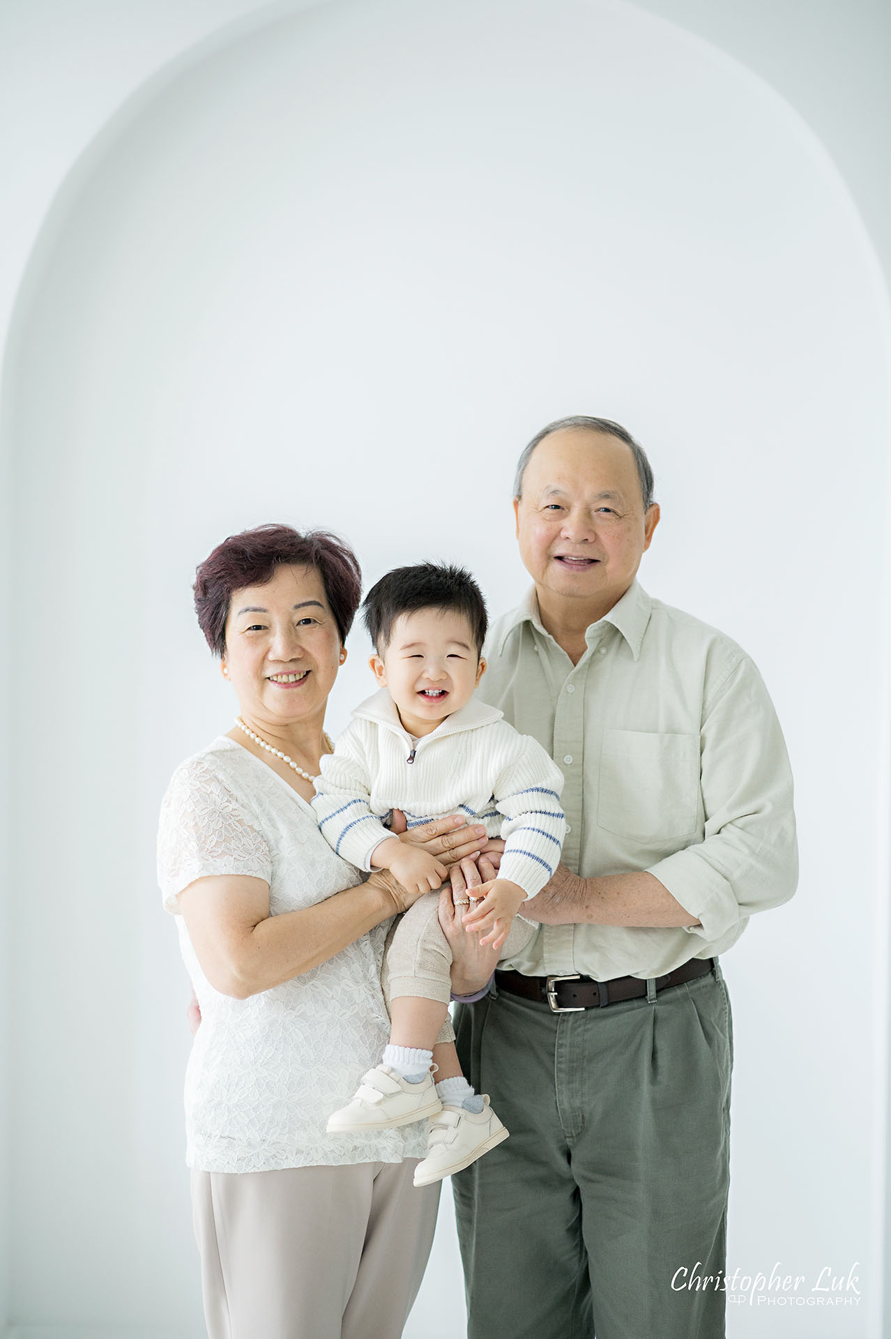 GrandMother GrandFather Baby Boy GrandSon Grandparents Grandchildren Family Portrait Smile Close Hug