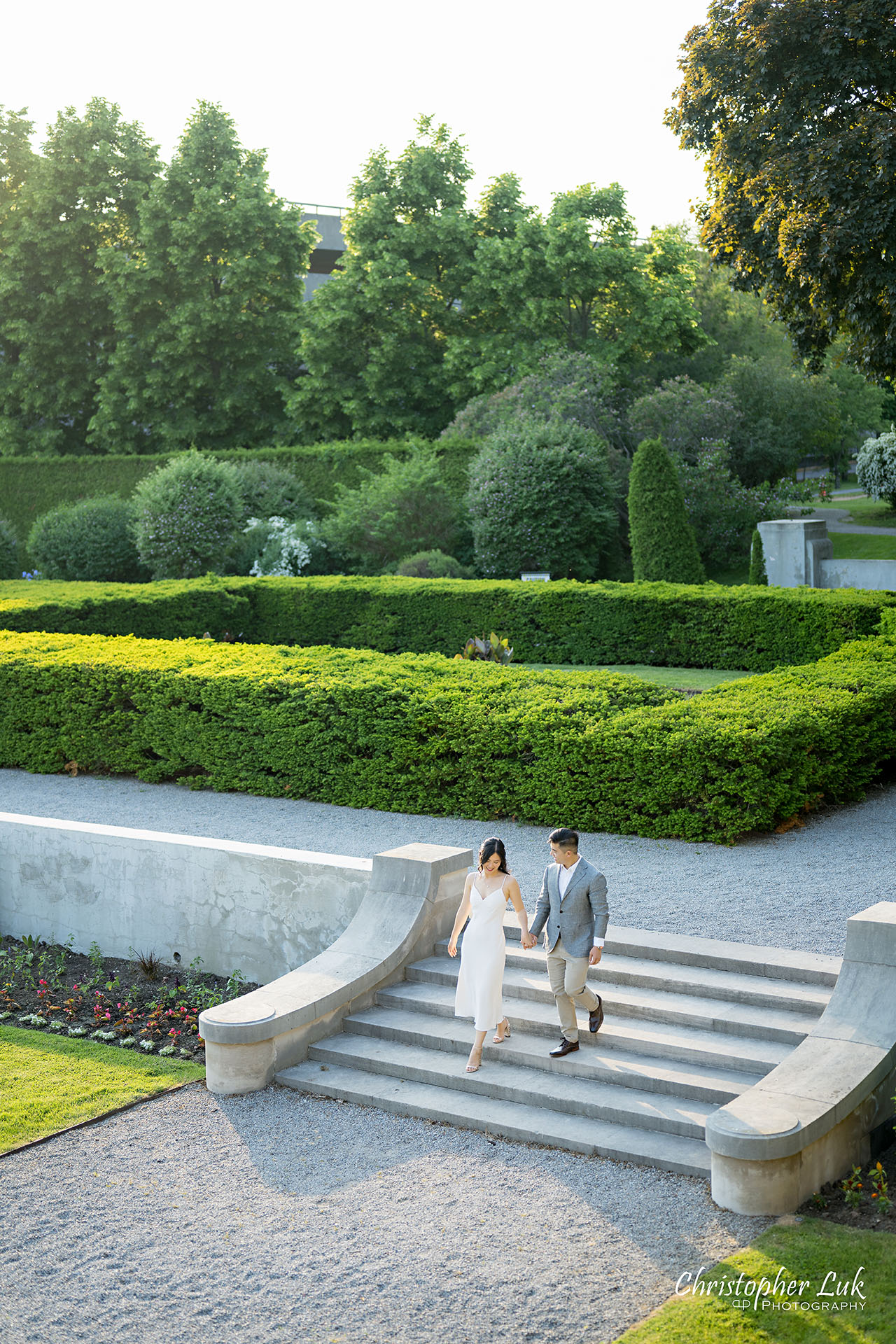 Parkwood Estate Bride Groom Engagement Session Formal Gardens Holding Hands Walking Together Stairs Portrait 