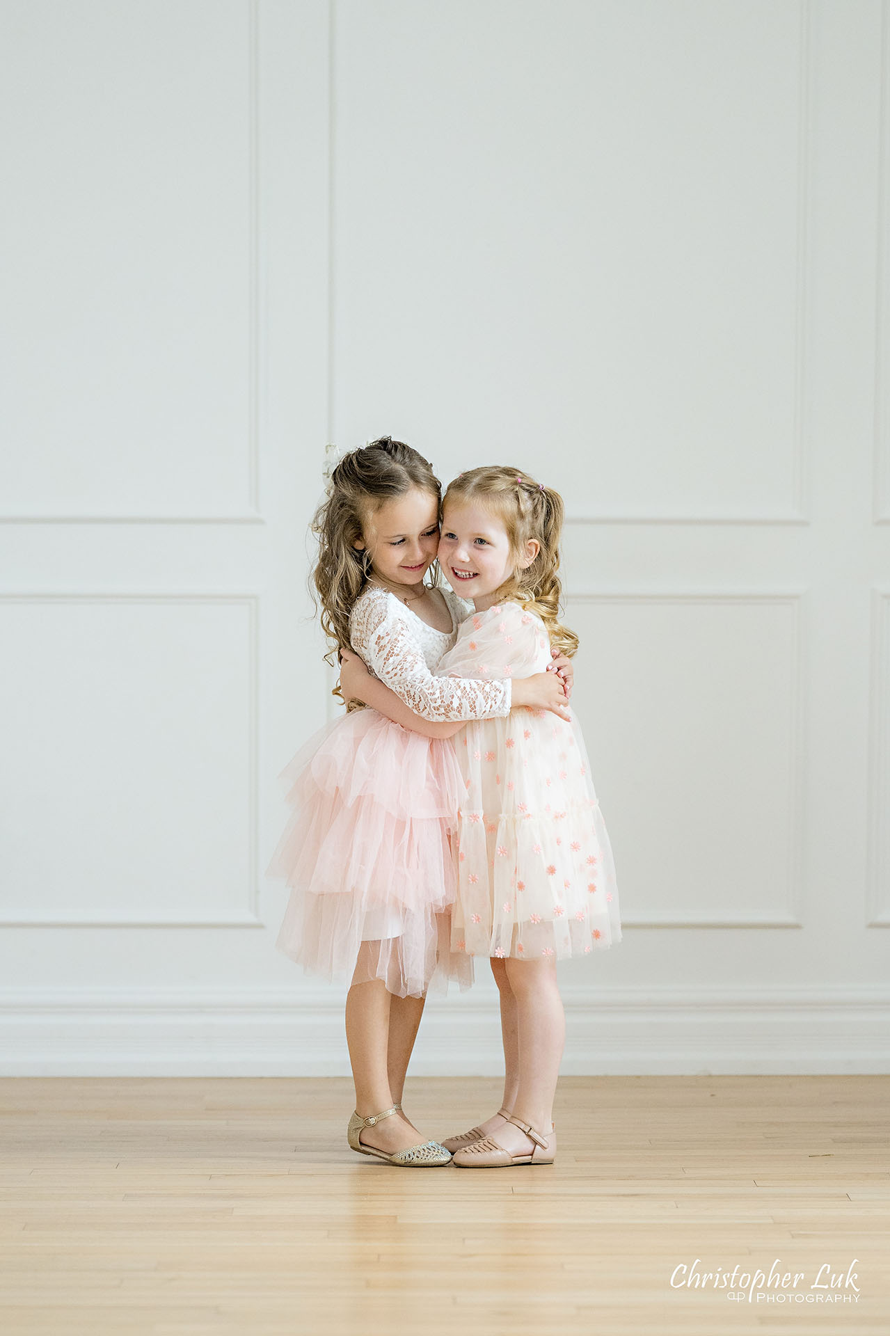 Cousins Sisters Daughters Girls White Pink Dresses Hug Hugging Cute Adorable Sweet Portrait