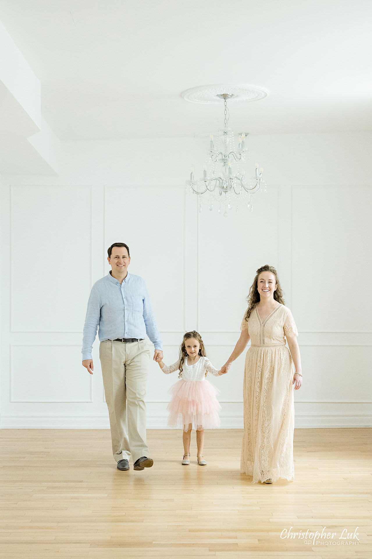 Family Mother Father Mom Dad Husband Wife Daughter Group Photo Natural Organic Candid Photojournalistic Smile Happy Holding Hands Walking Together Portrait