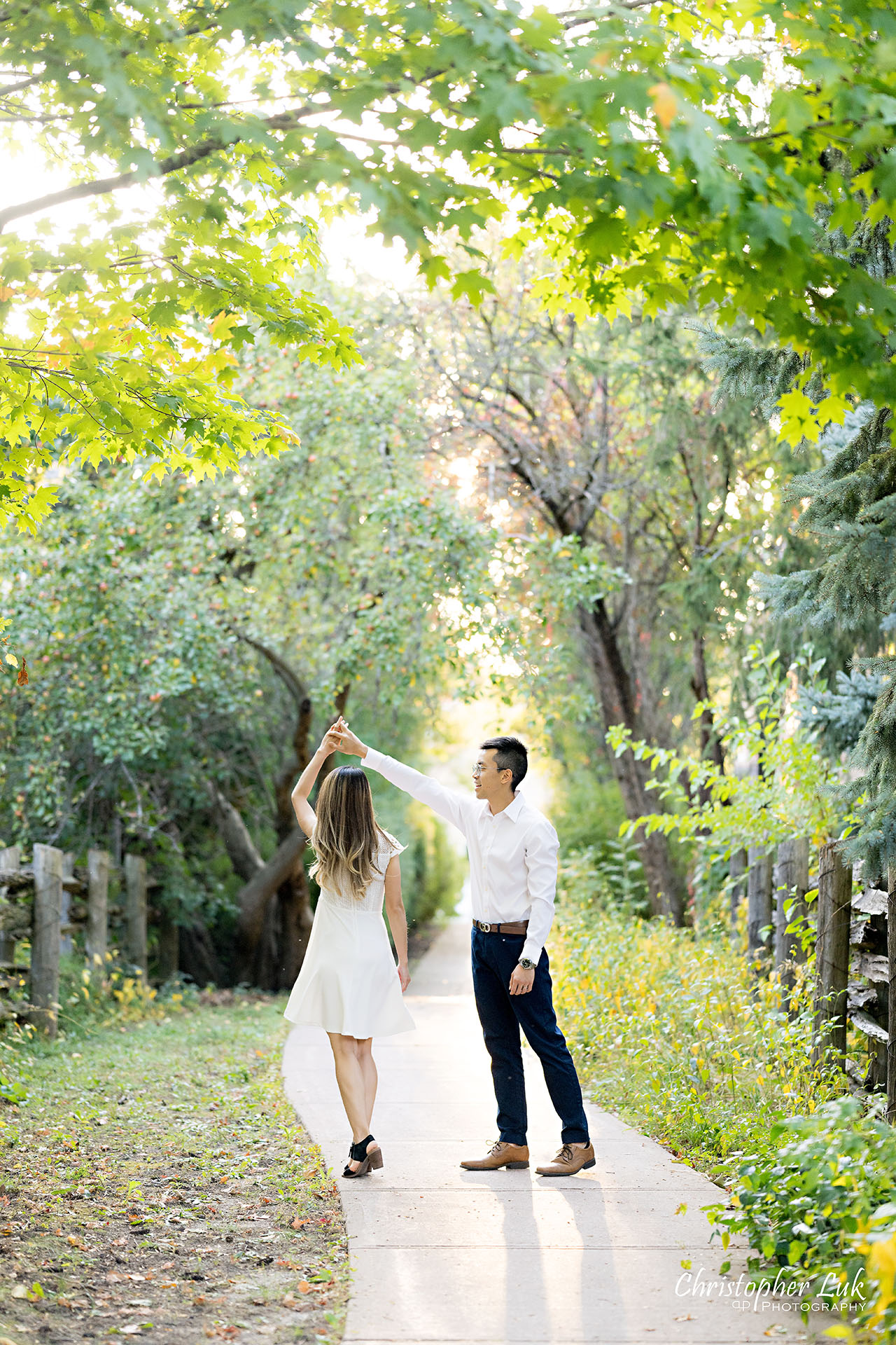 Christopher Luk Markham Family Photographer Photojournalistic Candid Natural Organic Husband Wife Mom Dad Dancing Twirling Spinning Together Cute Adorable Sweet Portrait