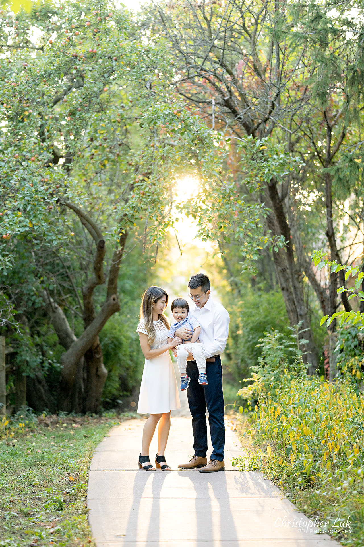 Christopher Luk Markham Family Photographer Photojournalistic Candid Natural Organic Husband Wife Mom Dad Son Child Family Holding Hands Hug Laugh Portrait