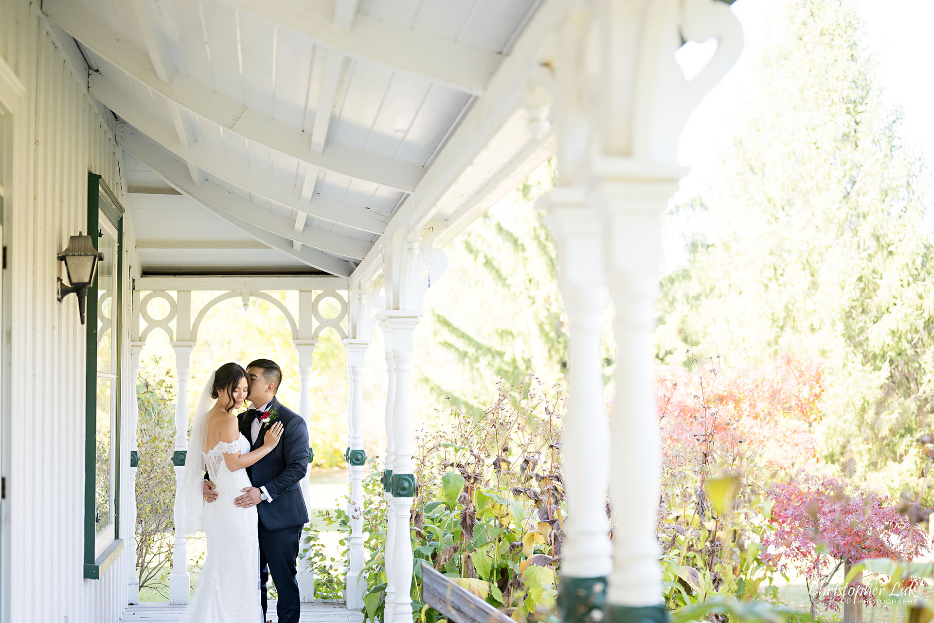 Markham Museum Burkholder House Verandah Bride Groom Natural Candid Photojournalistic Organic Moment Intimate Hug Smile Landscape Wide Kiss