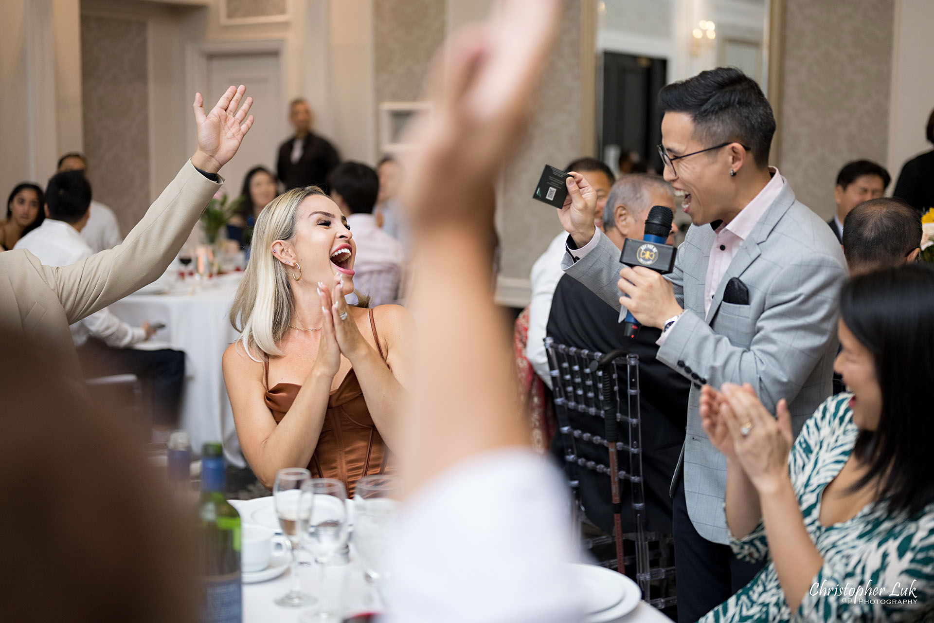 Crystal Fountain Event Venue Markham Wedding Dinner Reception Roy Wong Pro MC Multilingual Chinese English Emcee Playing a Game with Guests Candid Excited Reaction 