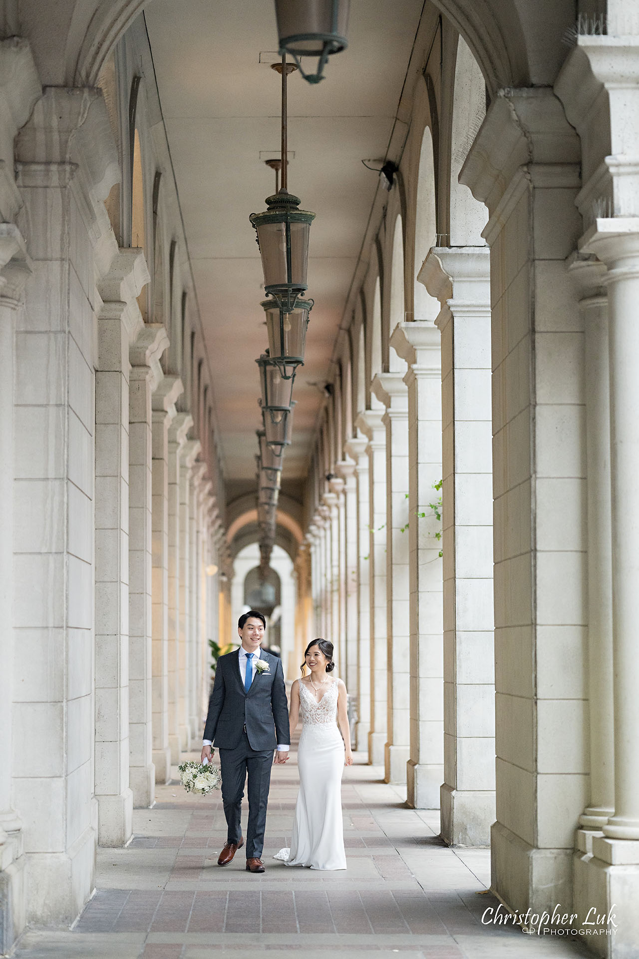 Bride Groom Wedding Together Candid Natural Organic Photojournalistic Streetscape Downtown Toronto Esplanade Architecture Majestic Royalty Holding Hands Walking Together Portrait