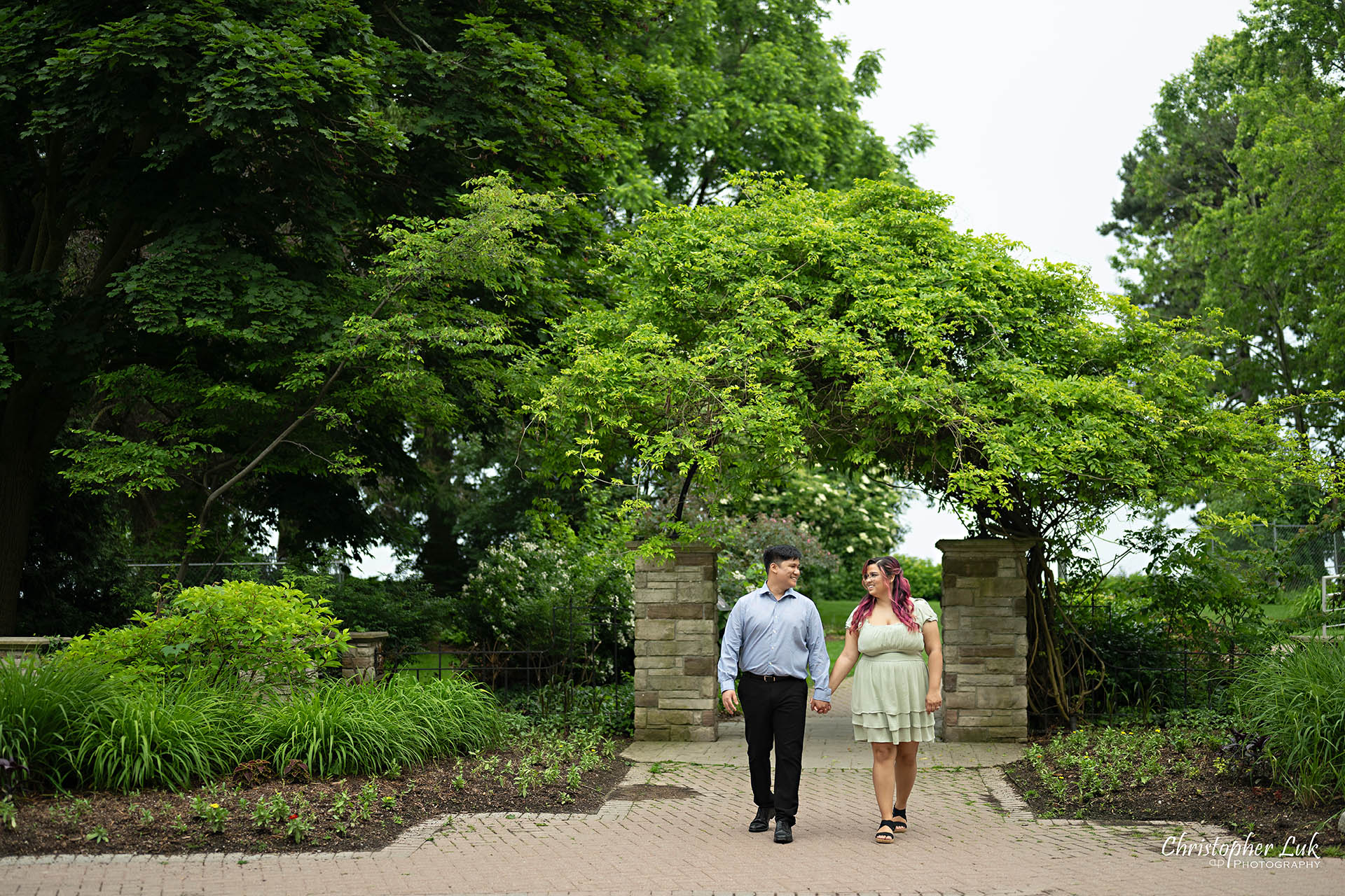 Adamson Estate Tree Leaves Ivy Arch Gate Bride Groom Holding Hands Walking Together Candid Organic Natural Photojournalistic Landscape 