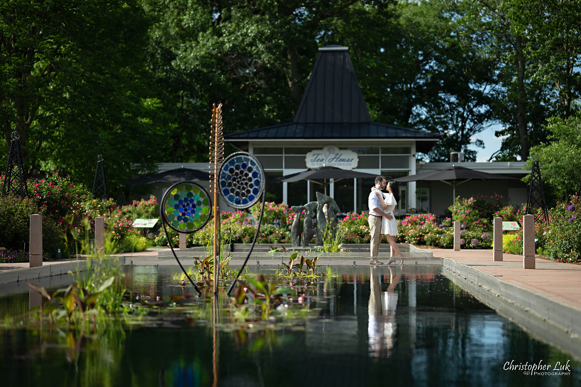 Groom with Bride Hug Together Floral Dress Mirror Reflecting Pool Landscape