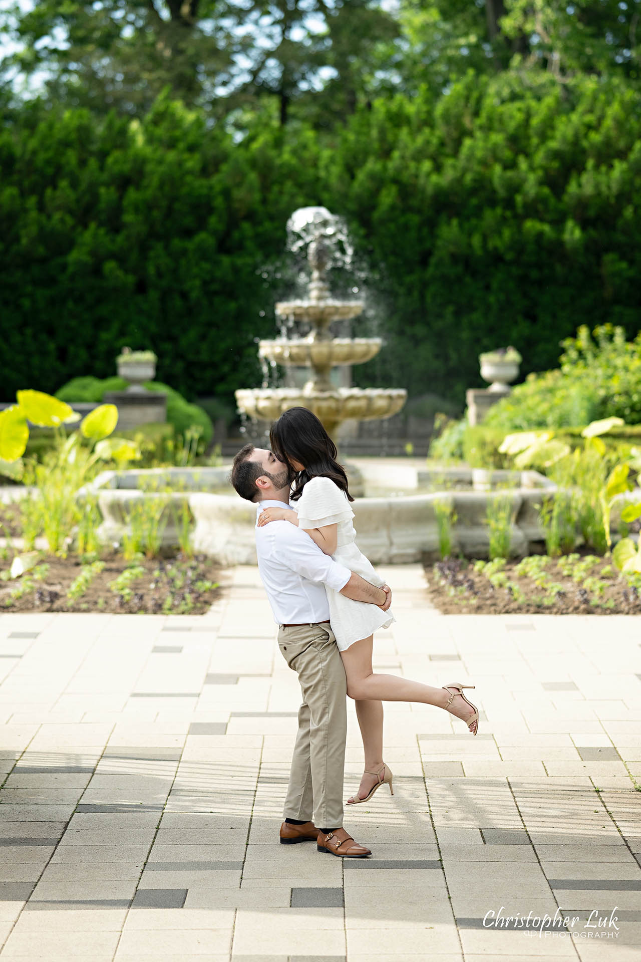 Bride with Groom Candid Natural Photojournalistic Organic Lift Hug Kiss Romantic Water Fountain
