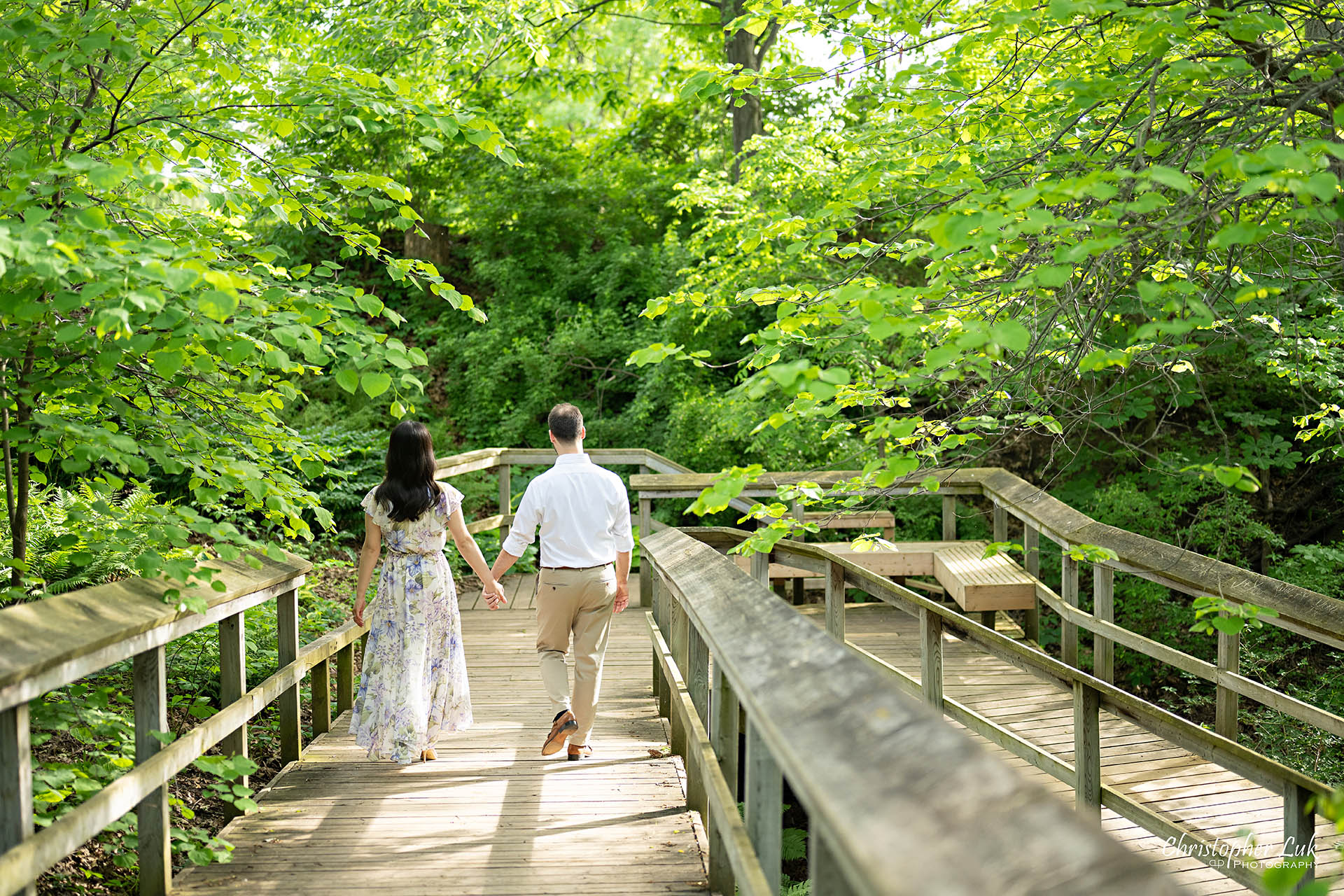 Bride with Groom Holding Hands Walking Together Boardwalk Forest Woodland Candid Natural Photojournalistic Organic