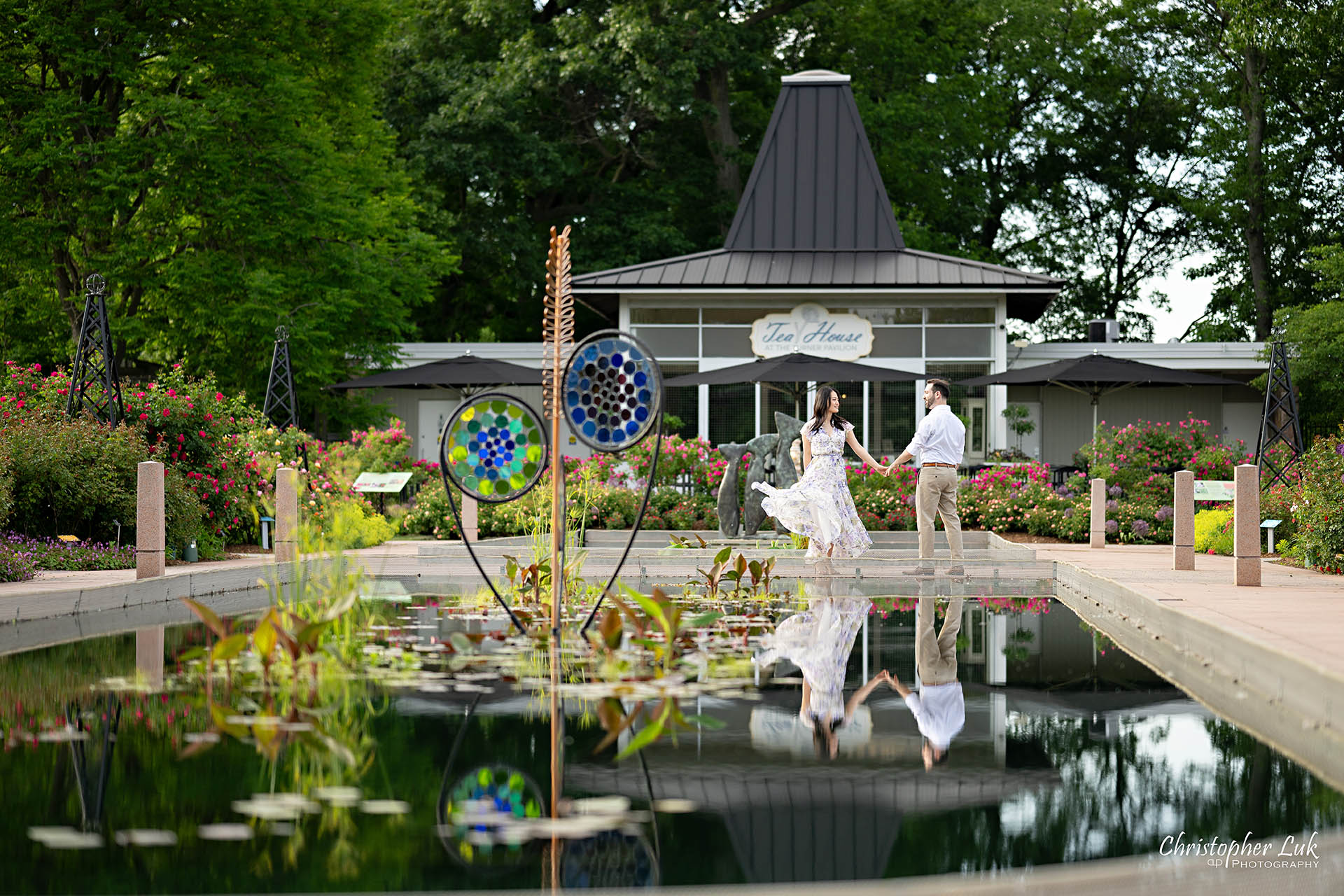 Groom with Bride Moving Flowing Floral Dress Mirror Reflecting Pool Landscape