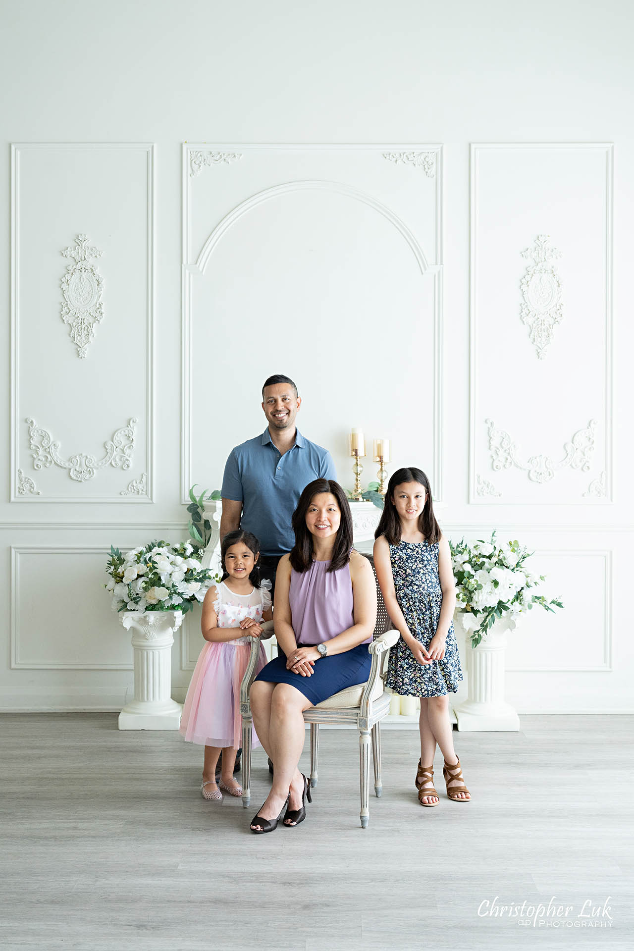 Parents Children family photo posed smile studio portrait