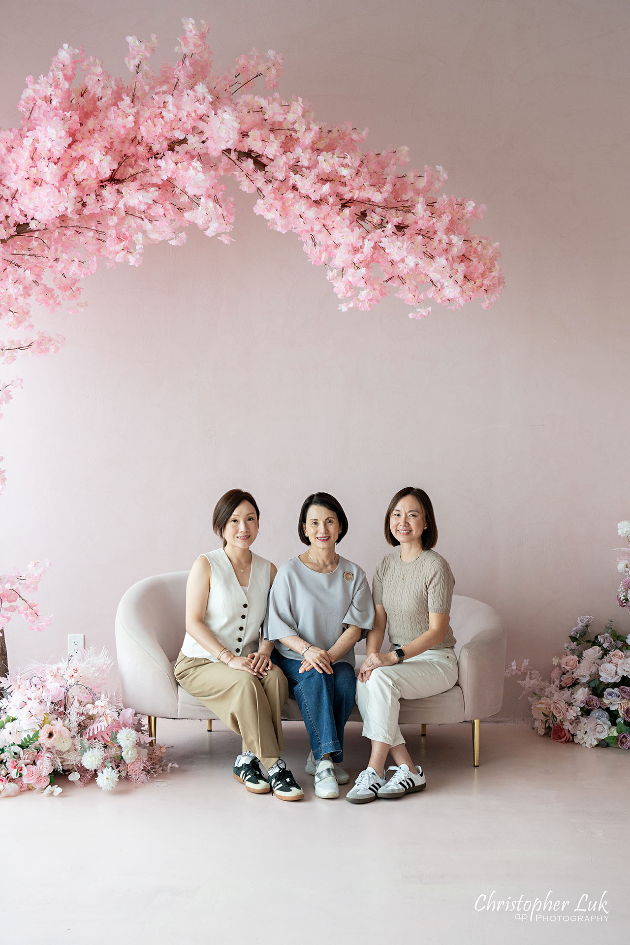 Grandmother Mothers Sisters Daughters Women Family Together Under a Pink Cherry Blossom Tree Portrait