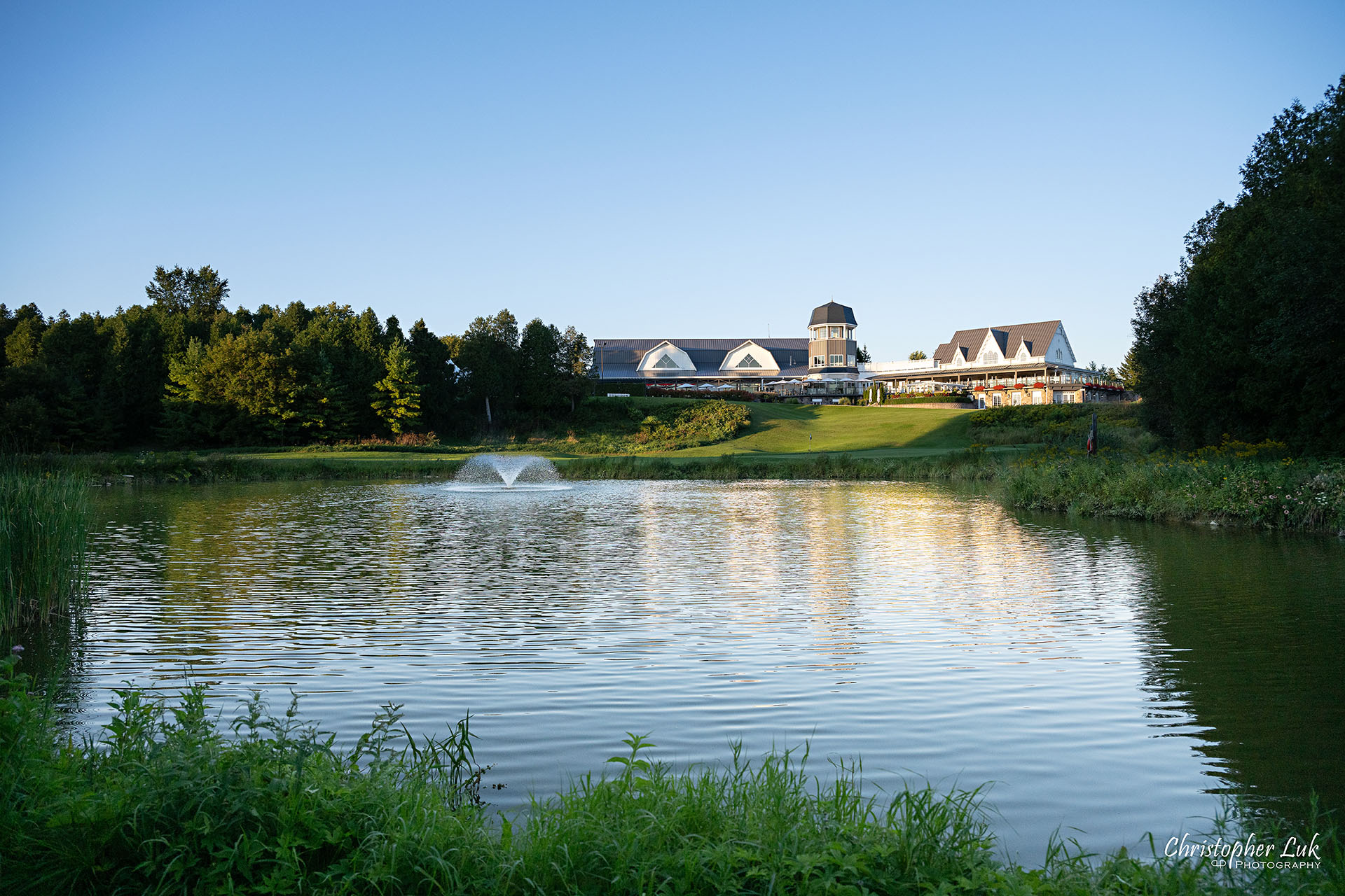 Angus Glen Golf Club Wedding Sunset Golden Hour Clubhouse Pond Water Fountain Scenic Landscape 