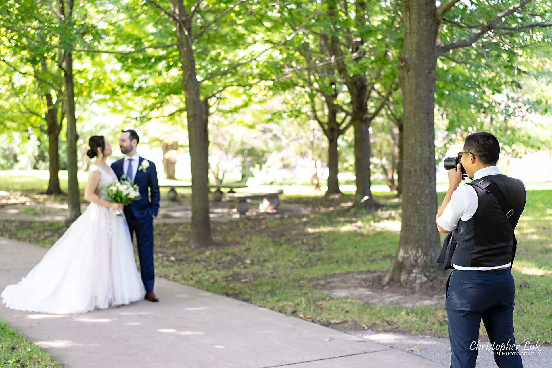 Christopher Luk Toronto Wedding Photographer Behind the Scenes Bride and Groom Taking Pictures Landscape