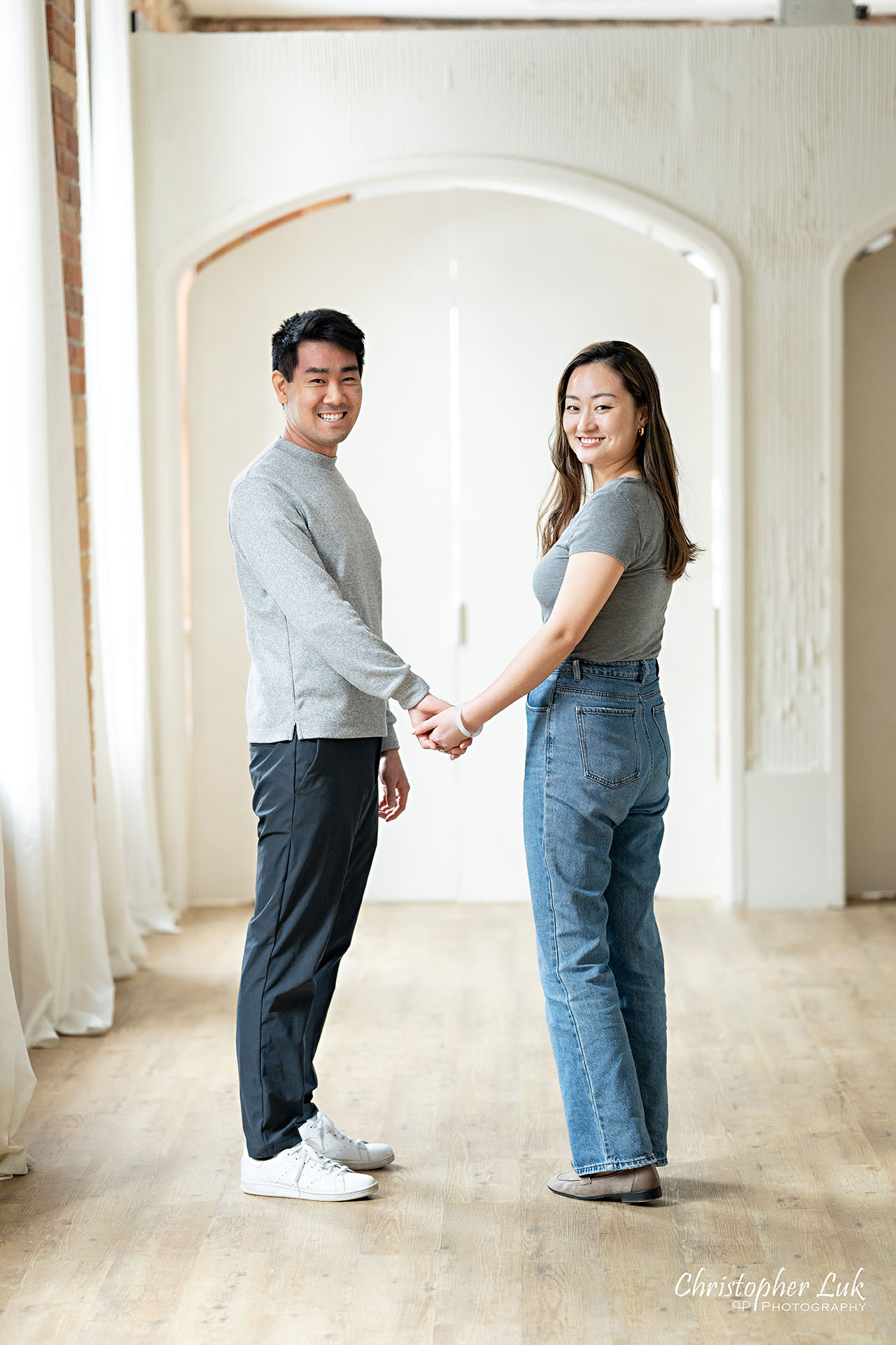 Archive Studios Toronto Surprise Wedding Proposal Bride Groom Holding Hands Looking Back Smiling