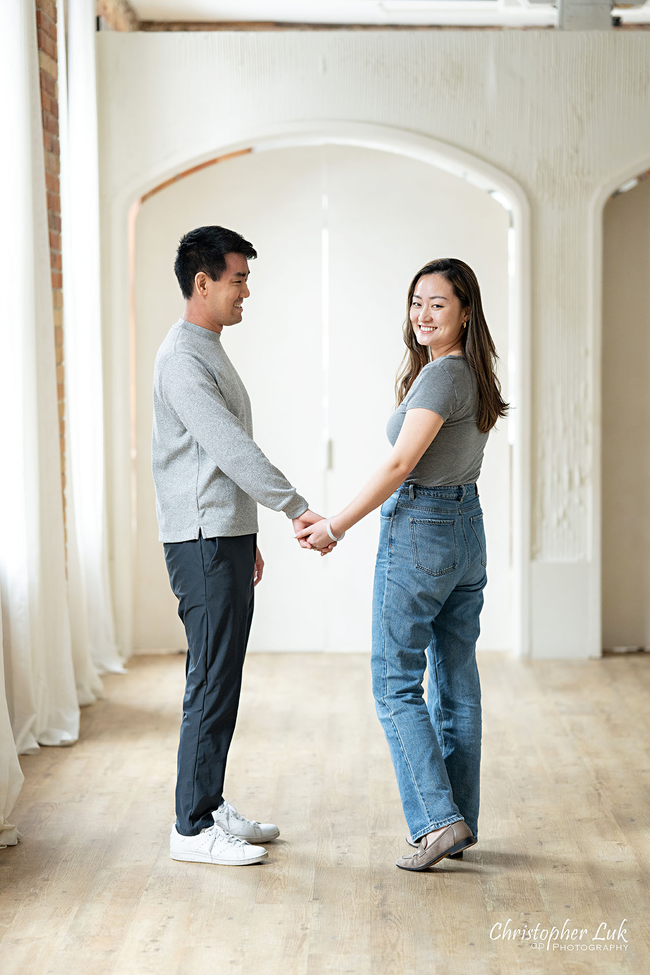 Archive Studios Toronto Surprise Wedding Proposal Bride Groom Holding Hands Looking Back Smiling